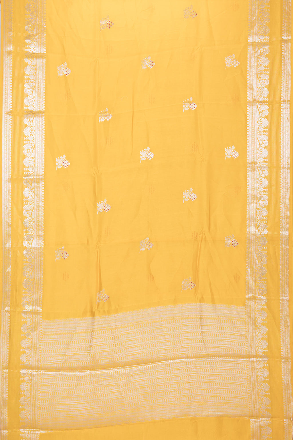 Flat view of Yellow Blended Tussar Silk Saree with Zari Butta on the body and Zari Border. 