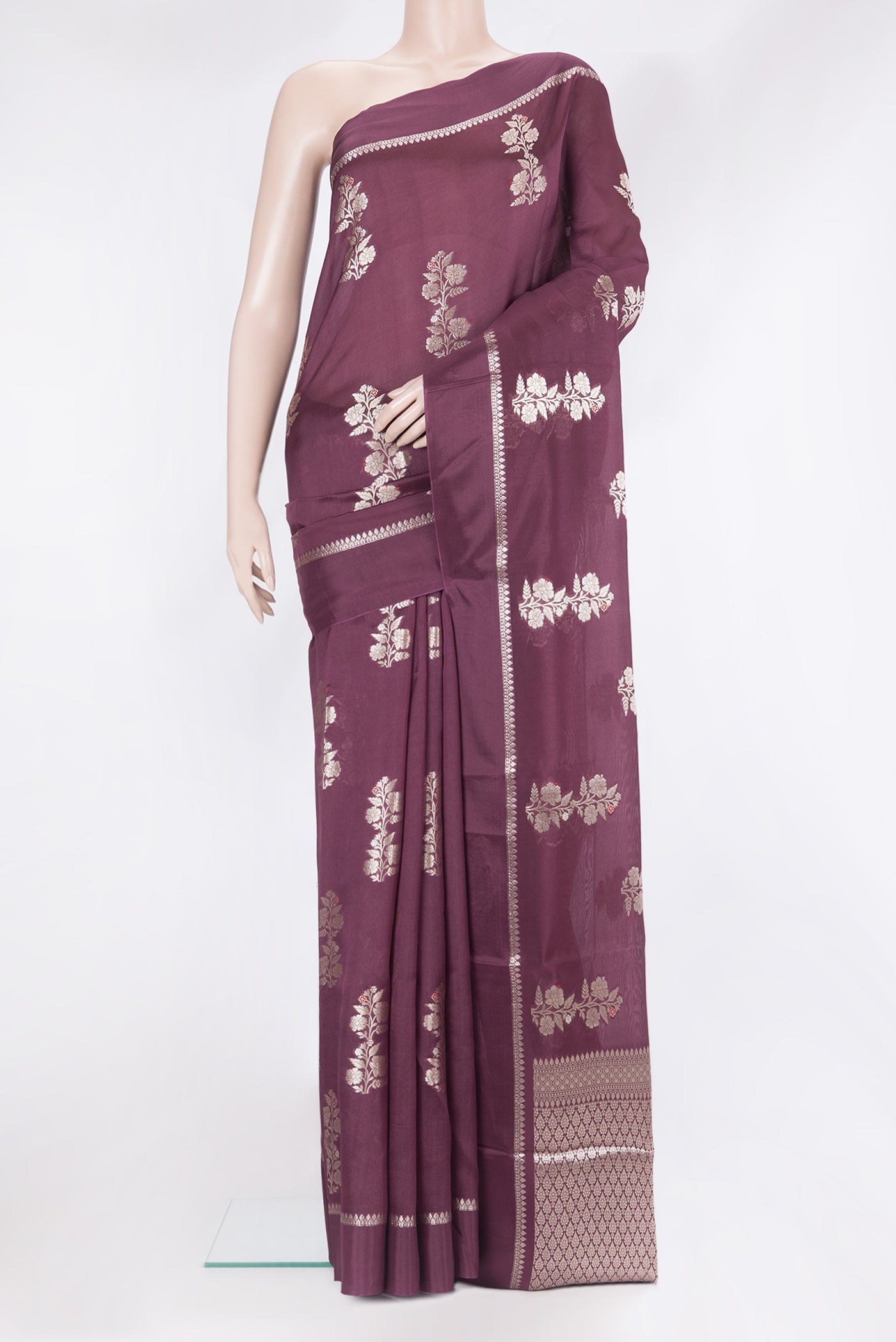 Burgundy Blended Tussar Silk Saree with Zari Butta on the body and Zari Border.  displayed on a mannequin