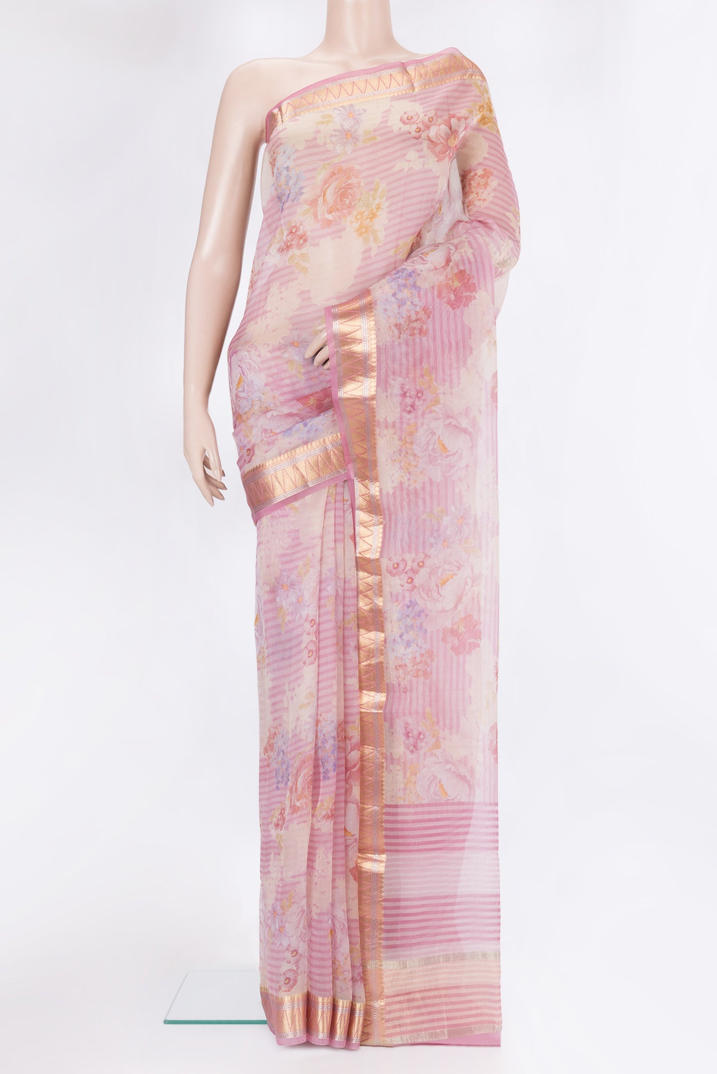 Rose pink Organza Silk Saree with Floral Print on the body and Zari Border.  displayed on a mannequin