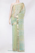 Pista Green Organza Silk Saree with Printed design on the body and Zari Border.  displayed on a mannequin