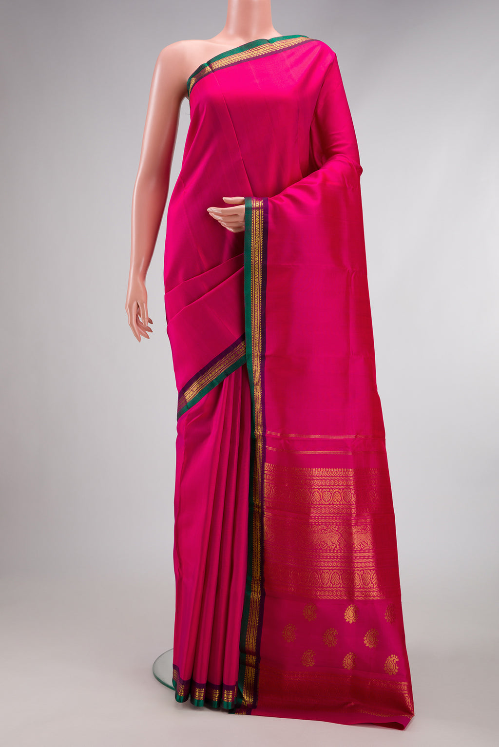 Pink Kanjivaram Silk Saree with Plain Body and Zari Border.  displayed on a mannequin