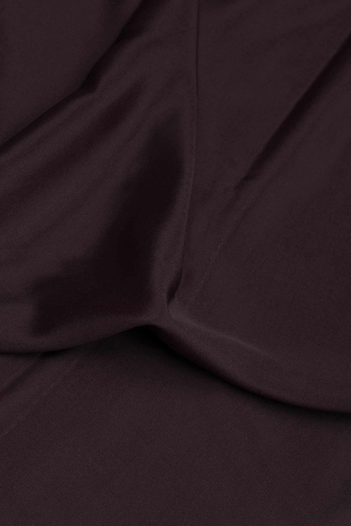 Close up of Coffee Brown Mysore Silk Saree with Plain Body and Fancy Border.  displaying folds
