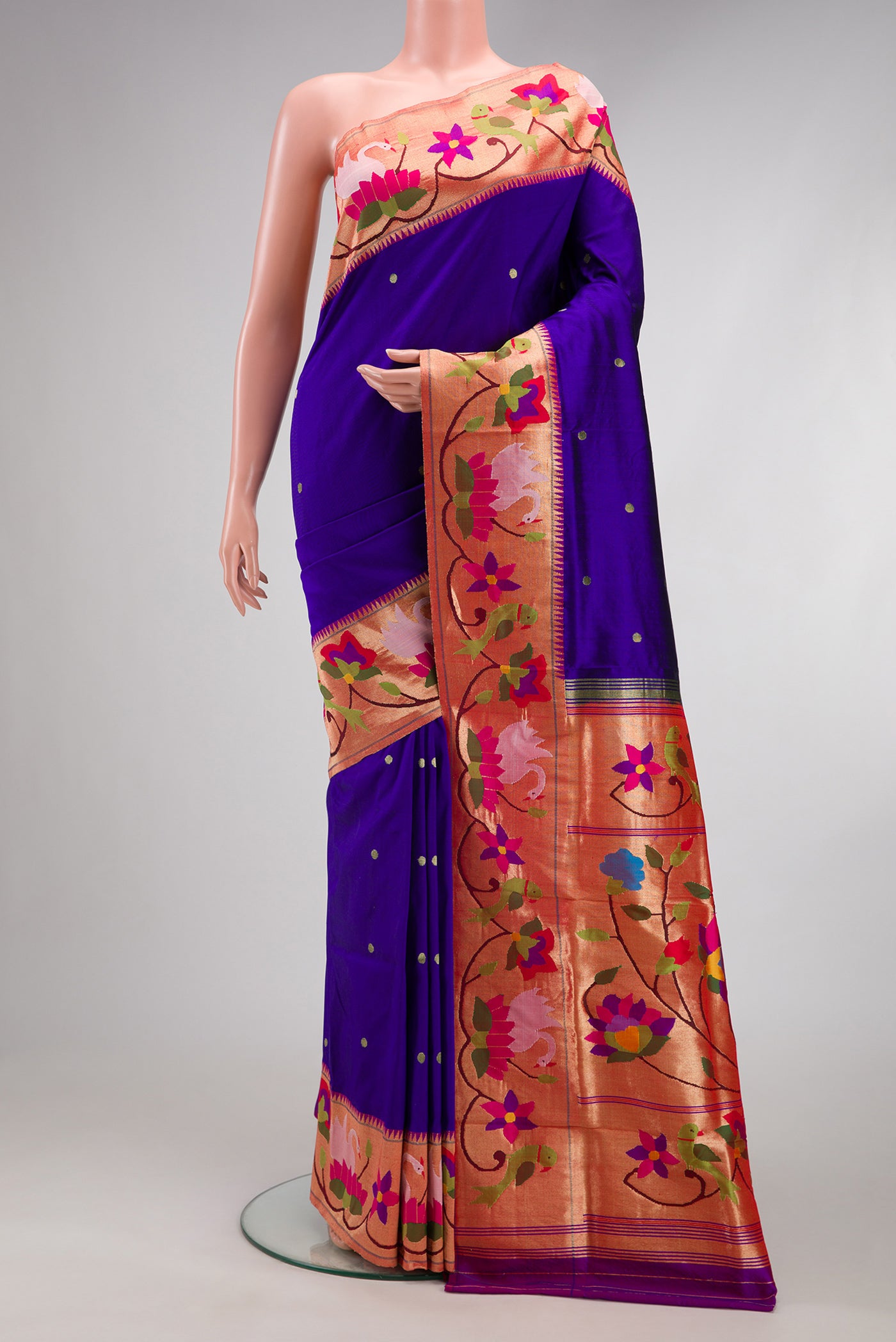 Royal Blue Paithani Silk Saree with Zari Butta on the body and Paithani Border.  displayed on a mannequin