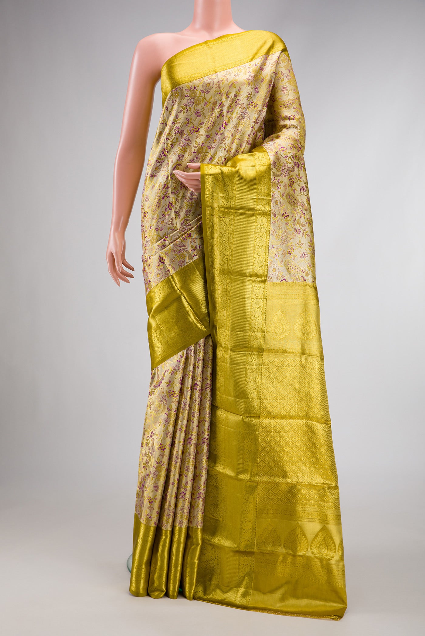 Gold Dual Tone Kanchipuram Tissue Silk Saree with Zari Brocade on the body and Zari Border.  displayed on a mannequin