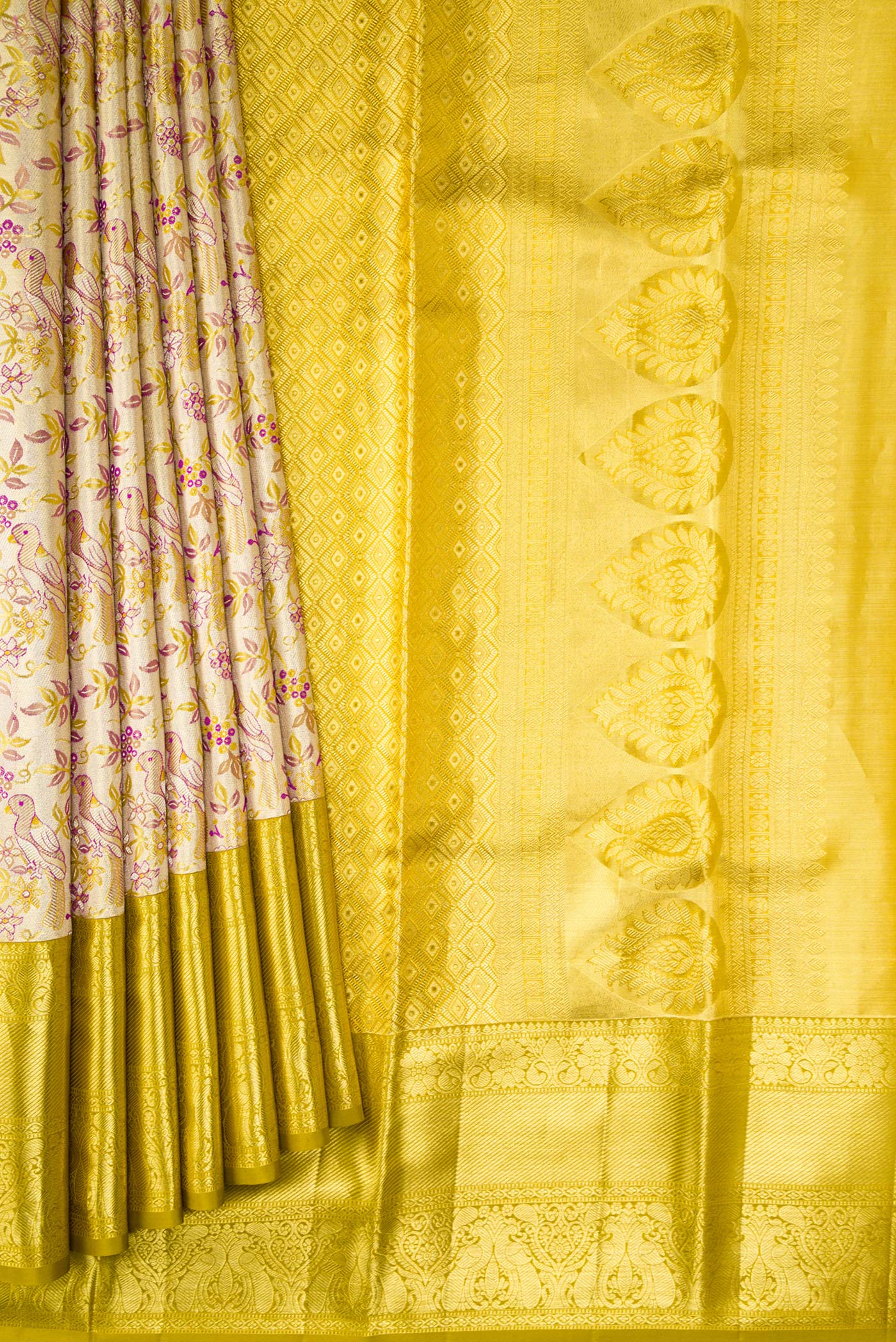 Pleats and pallu of Gold Dual Tone Kanchipuram Tissue Silk Saree with Zari Brocade on the body and Zari Border. 