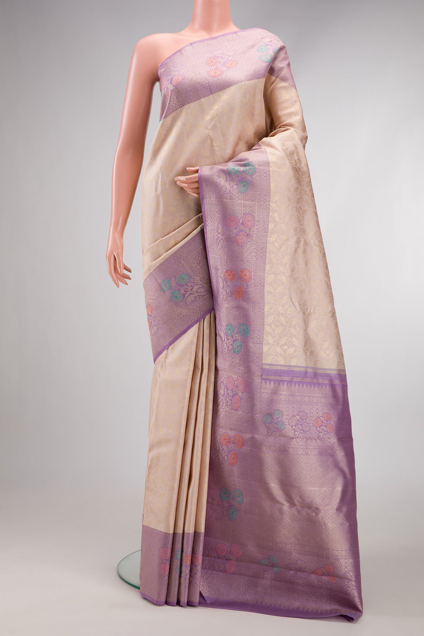 Golden Peach Dual Tone Kanchipuram Silk Saree with Zari Brocade on the body and Fancy Border.  displayed on a mannequin