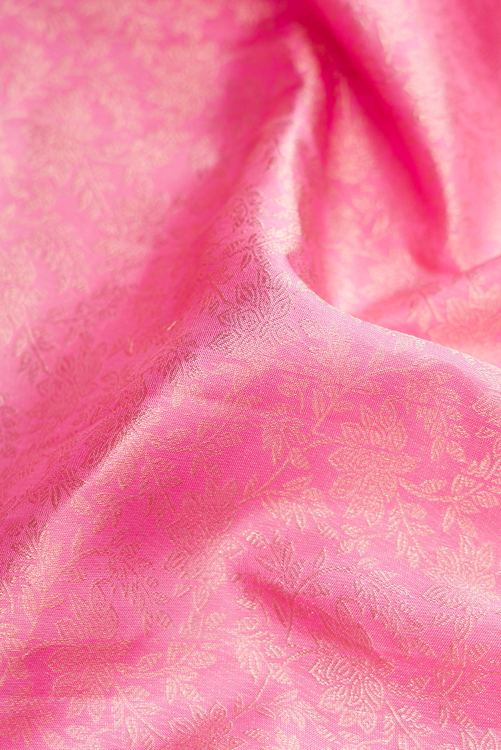 Close up of Pink Dual Tone Kanchipuram Silk Saree with Zari Brocade on the body and Zari Border.  displaying folds