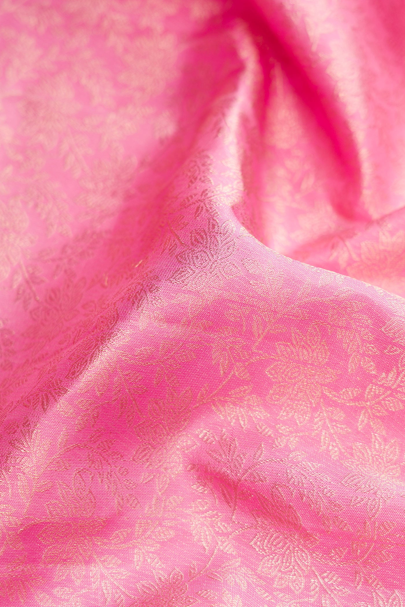 Close up of Pink Dual Tone Kanchipuram Silk Saree with Zari Brocade on the body and Zari Border.  displaying folds