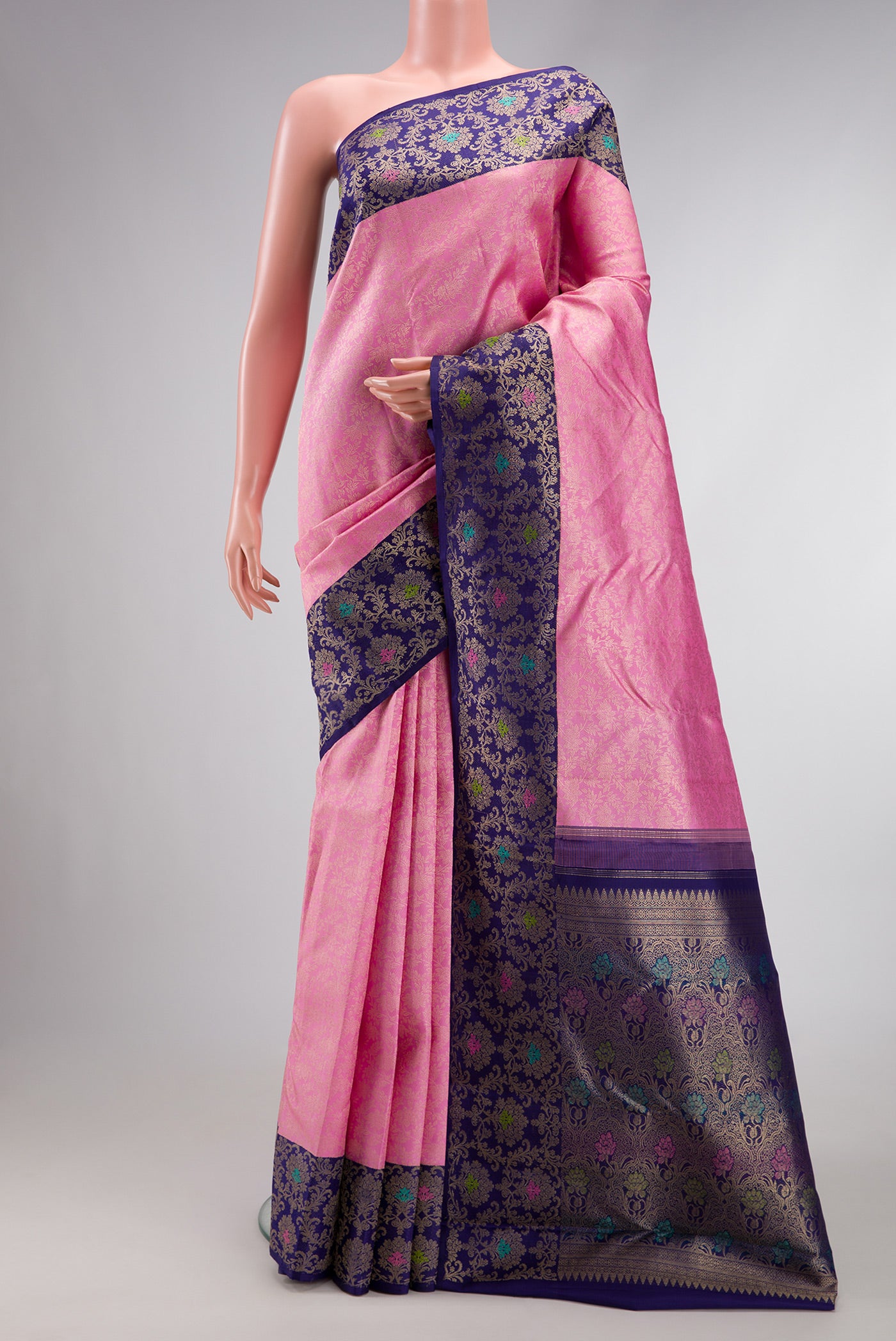 Pink Dual Tone Kanchipuram Silk Saree with Zari Brocade on the body and Zari Border.  displayed on a mannequin