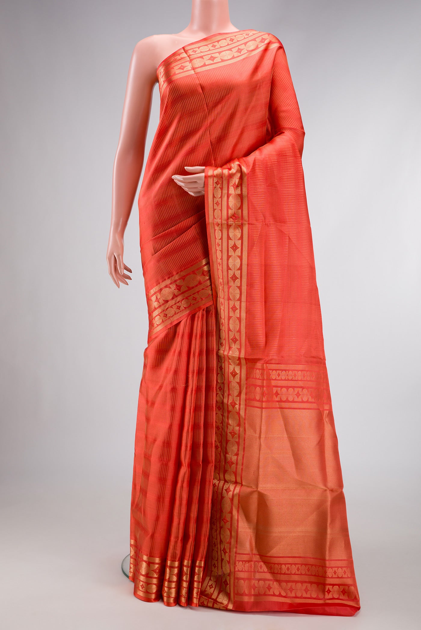 Golden Peach Dual Tone Soft Silk Saree with Zari Brocade on the body and Zari Border.  displayed on a mannequin