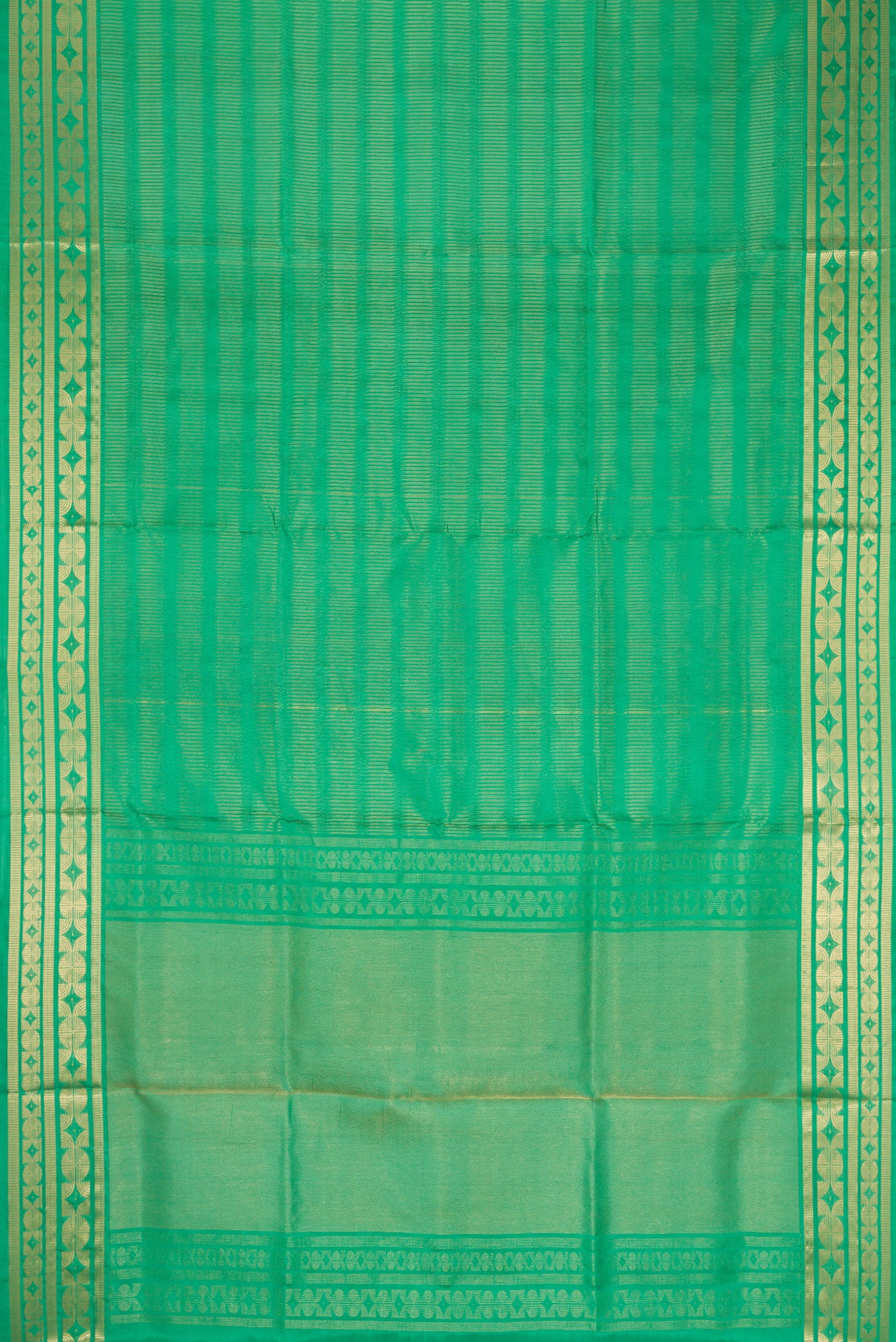 Flat view of Green Dual Tone Soft Silk Saree with Zari Butta on the body and Zari Border. 