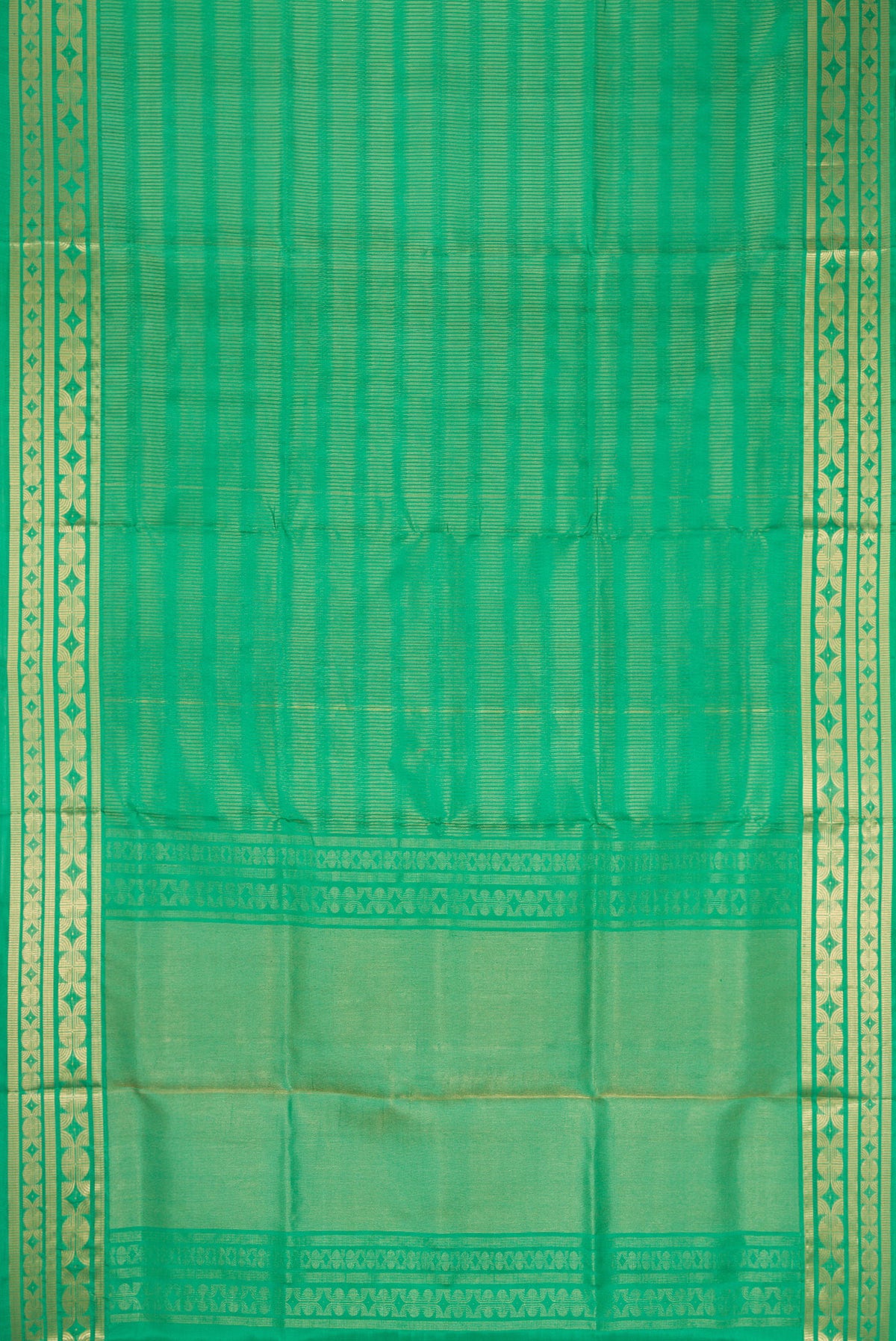 Flat view of Green Dual Tone Soft Silk Saree with Zari Butta on the body and Zari Border. 