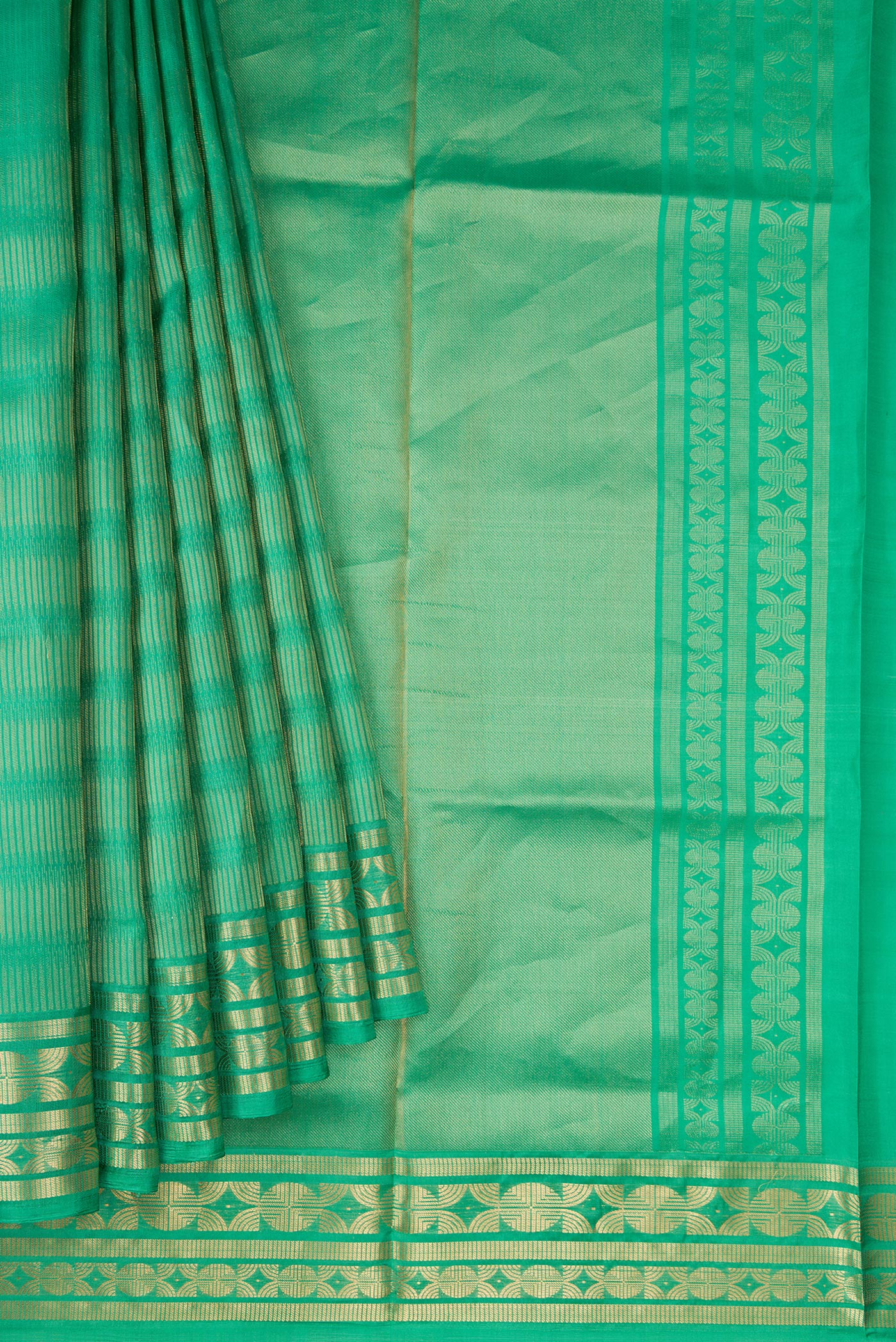 Pleats and pallu of Green Dual Tone Soft Silk Saree with Zari Butta on the body and Zari Border. 