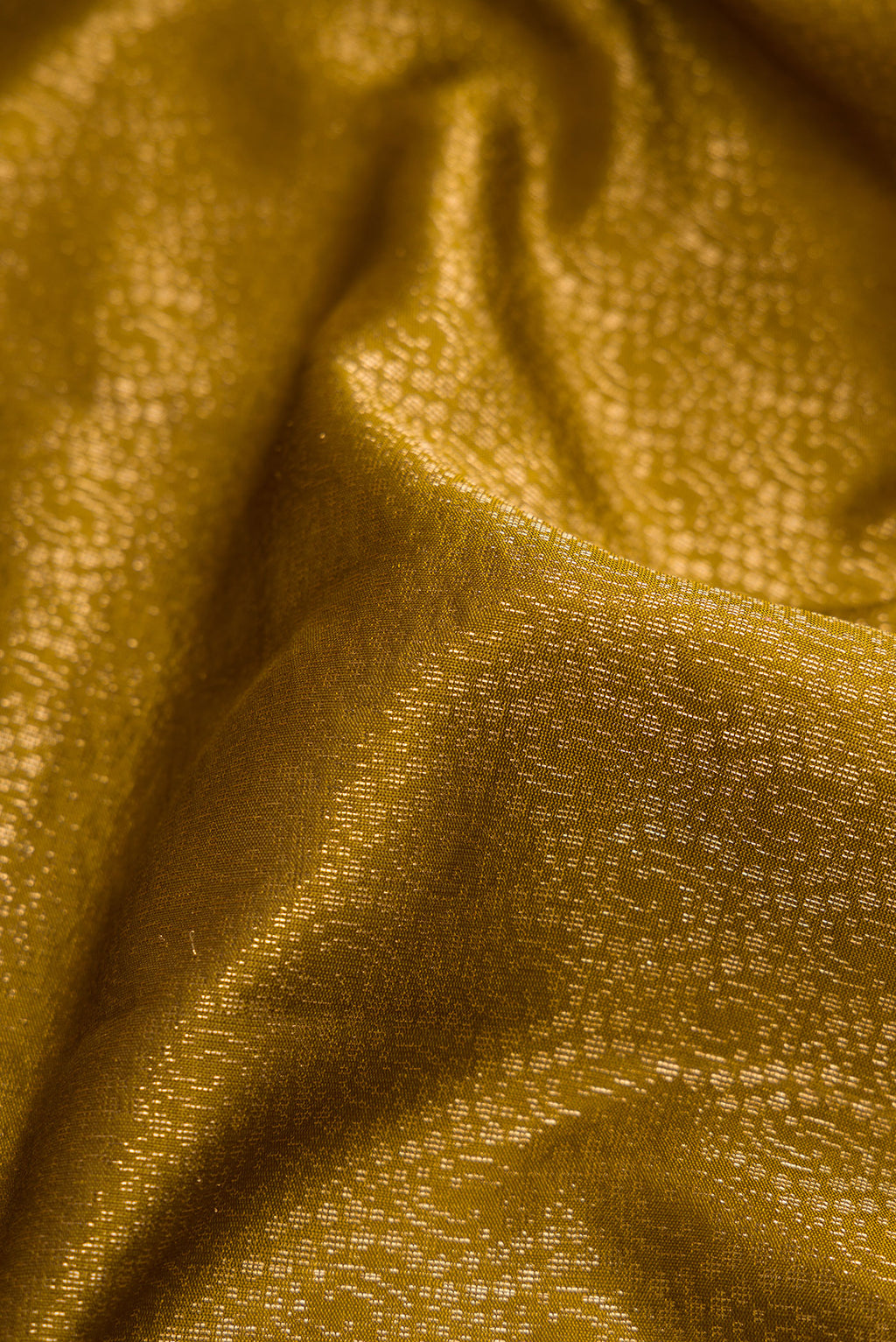 Close up of Mehandi Green Dual Tone Soft Silk Saree with Zari Brocade on the body and Zari Border.  displaying folds
