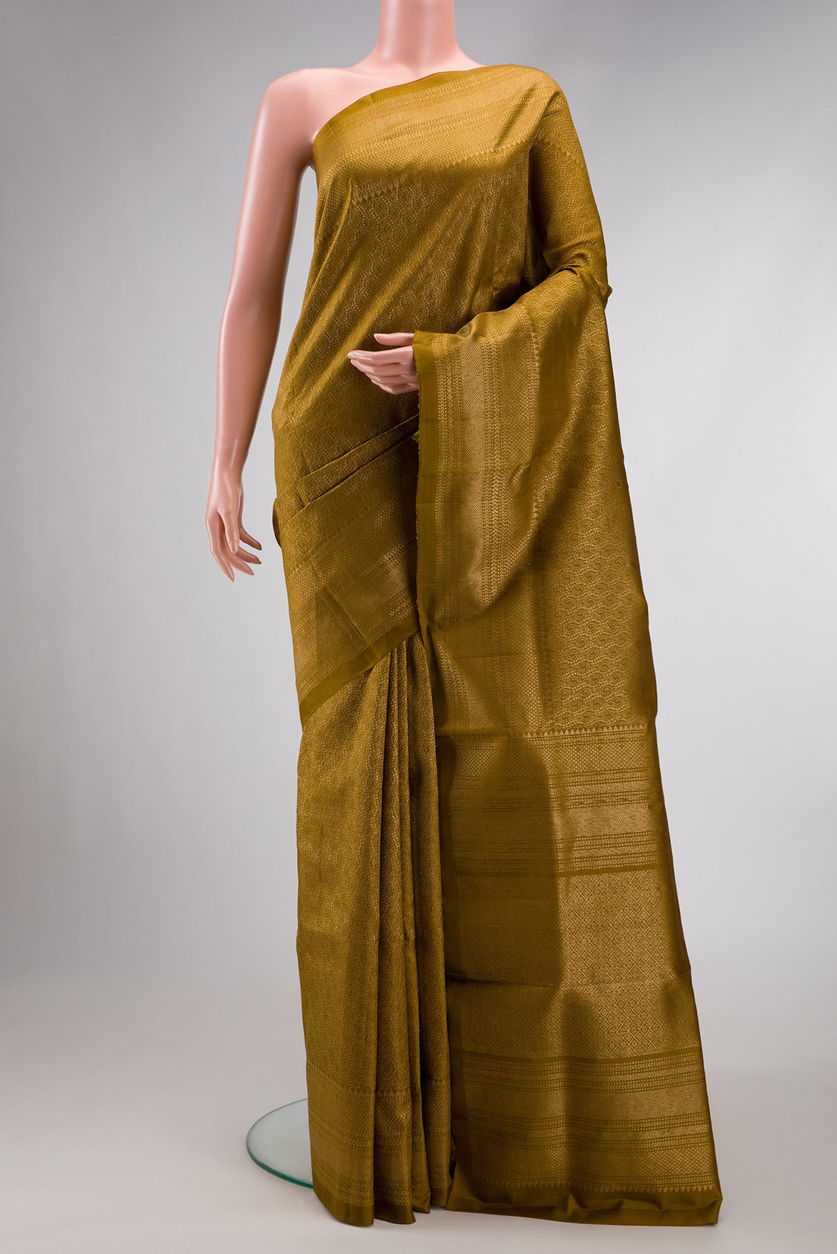 Mehandi Green Dual Tone Soft Silk Saree with Zari Brocade on the body and Zari Border.  displayed on a mannequin