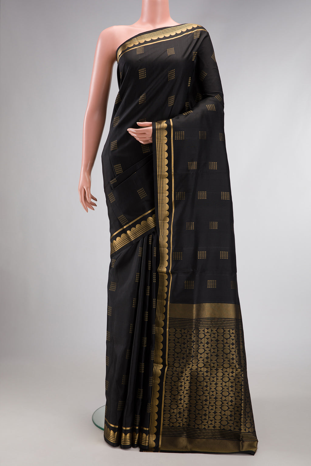 Black Dual Tone Soft Silk Saree with Zari Butta on the body and Zari Border.  displayed on a mannequin