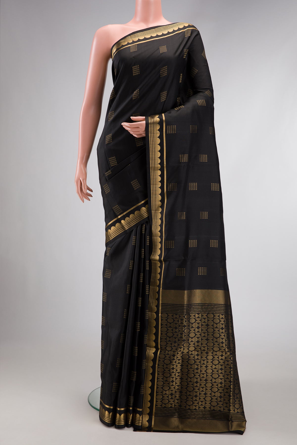 Black Dual Tone Soft Silk Saree with Zari Butta on the body and Zari Border.  displayed on a mannequin