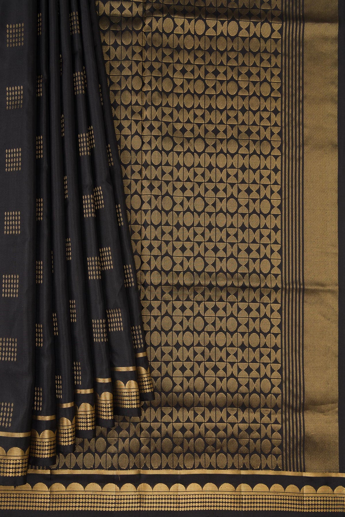 Pleats and pallu of Black Dual Tone Soft Silk Saree with Zari Butta on the body and Zari Border. 