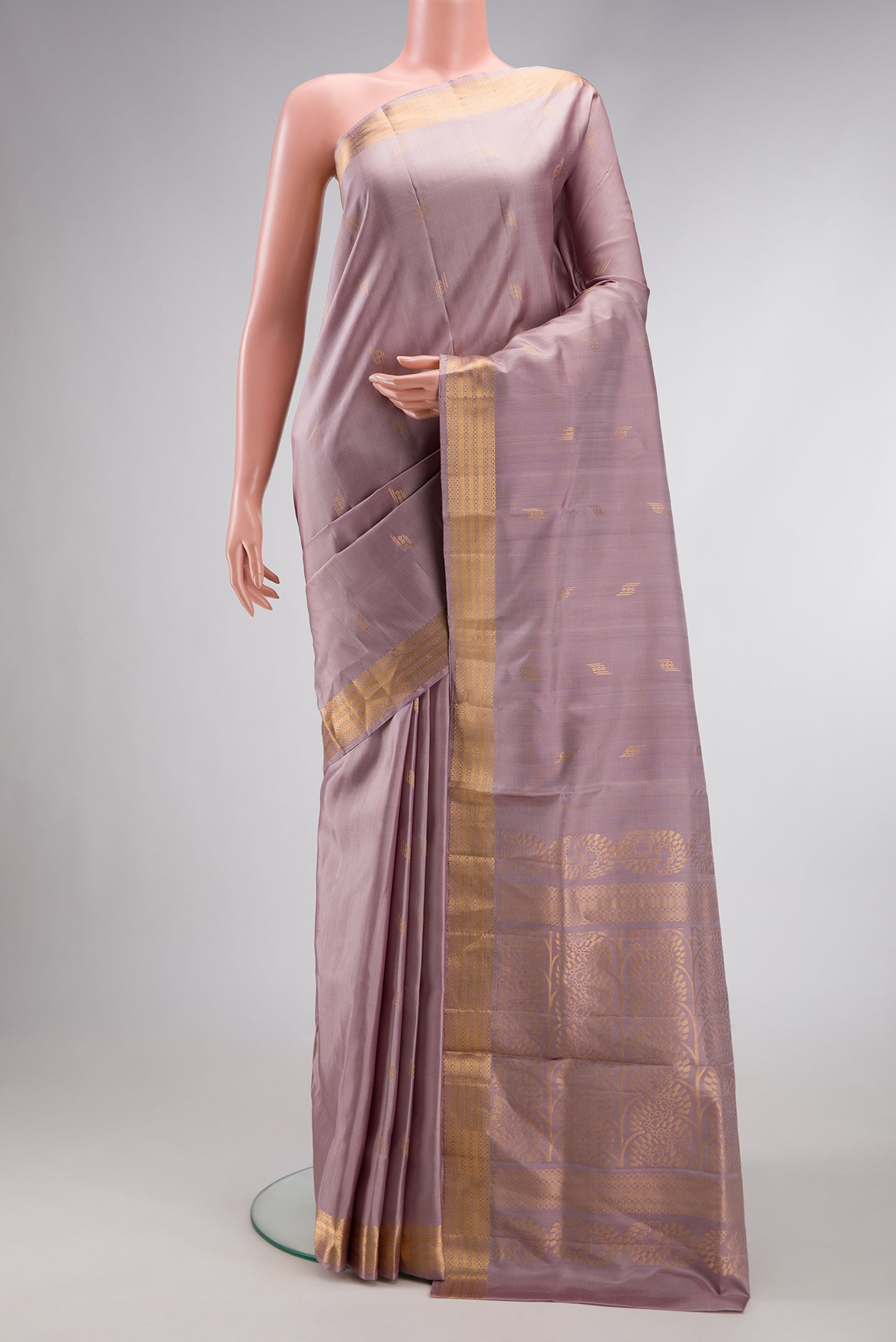 Brown Dual Tone Soft Silk Saree with Zari Butta on the body and Zari Border.  displayed on a mannequin