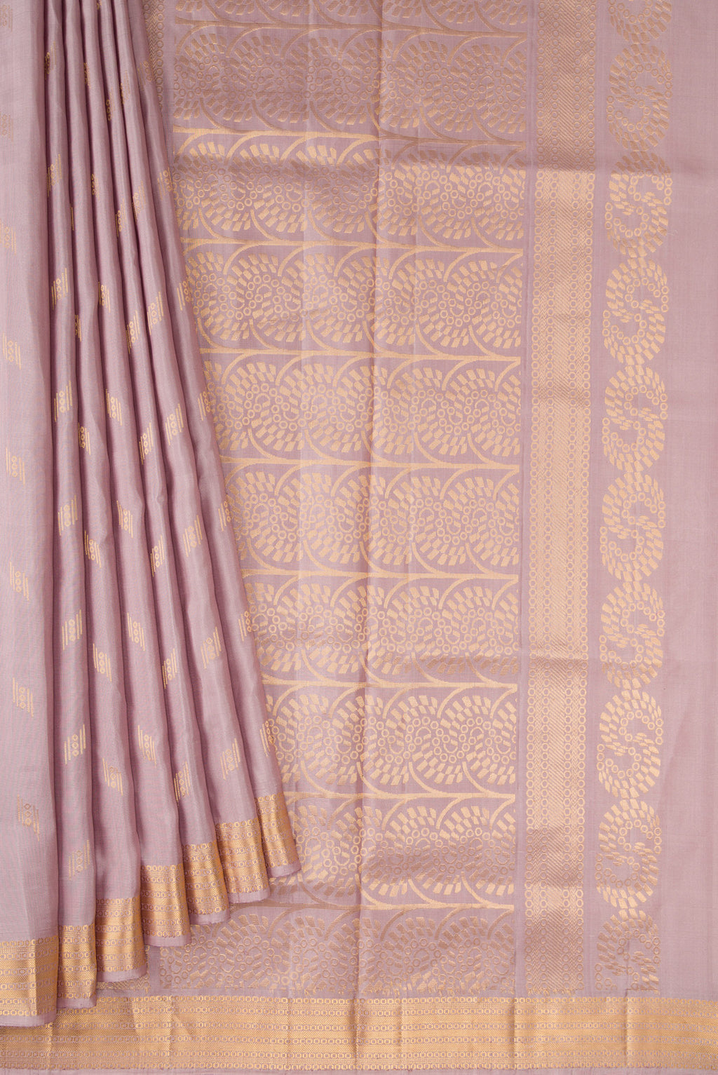 Pleats and pallu of Brown Dual Tone Soft Silk Saree with Zari Butta on the body and Zari Border. 
