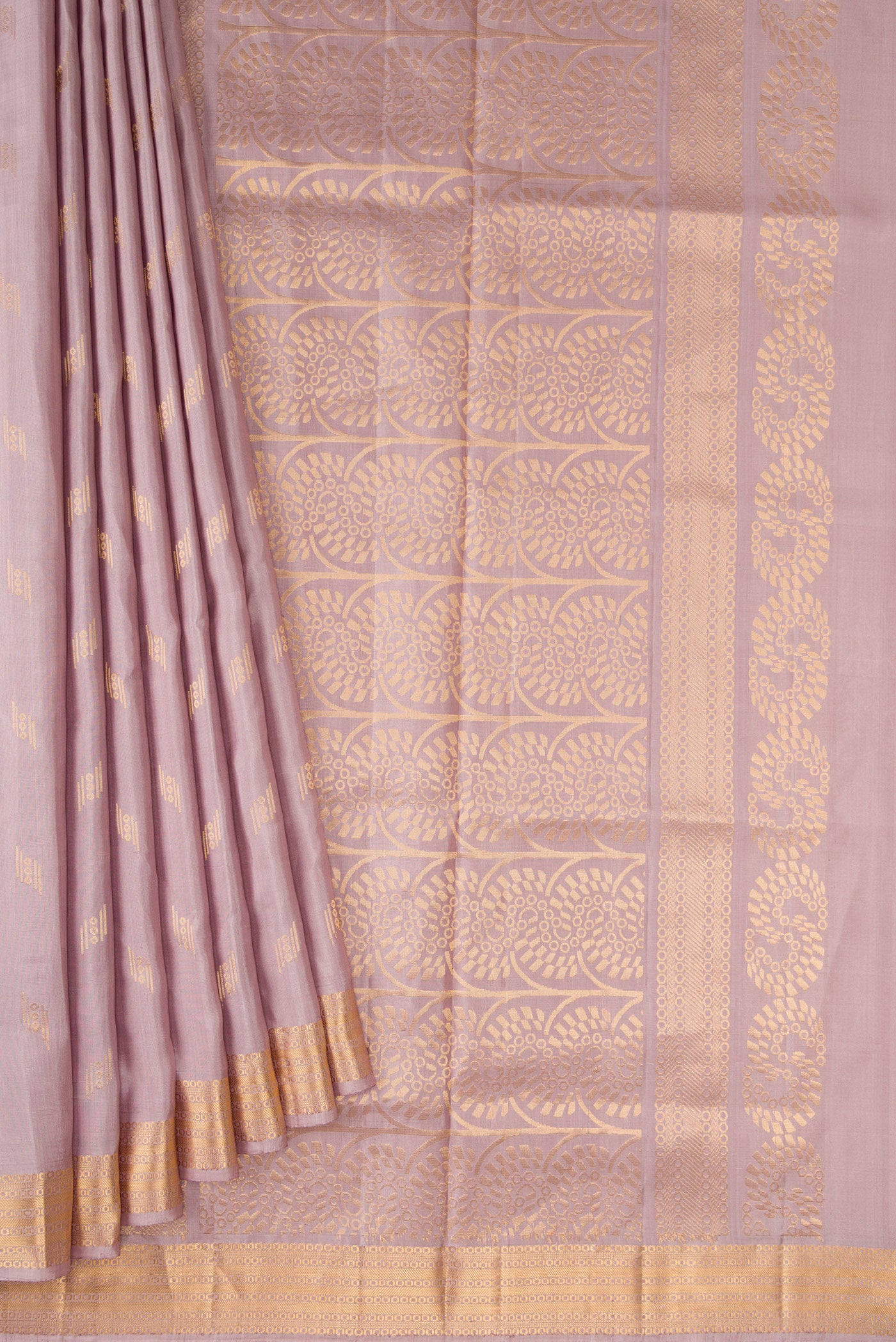 Pleats and pallu of Brown Dual Tone Soft Silk Saree with Zari Butta on the body and Zari Border. 