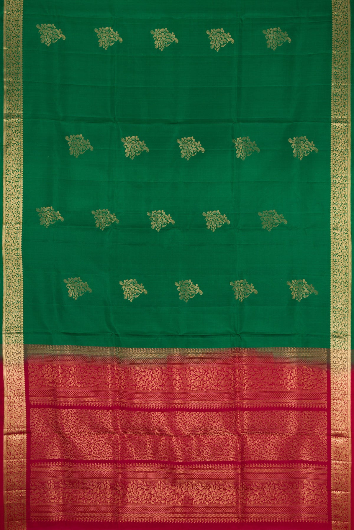 Flat view of Bottle Green Dual Tone Soft Silk Saree with Zari Butta on the body and Zari Border. 