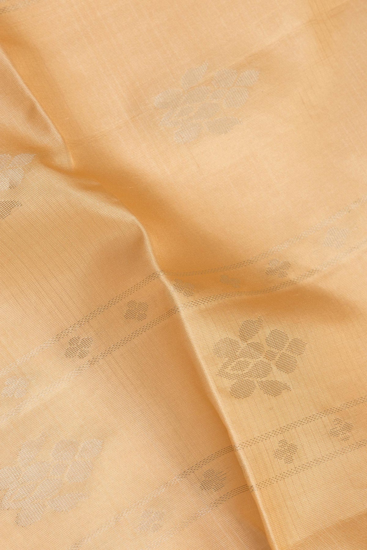 Close up of Pure Silk Sandal Dual Tone Soft Saree with Zari Butta on the body and Fancy Border.  displaying folds