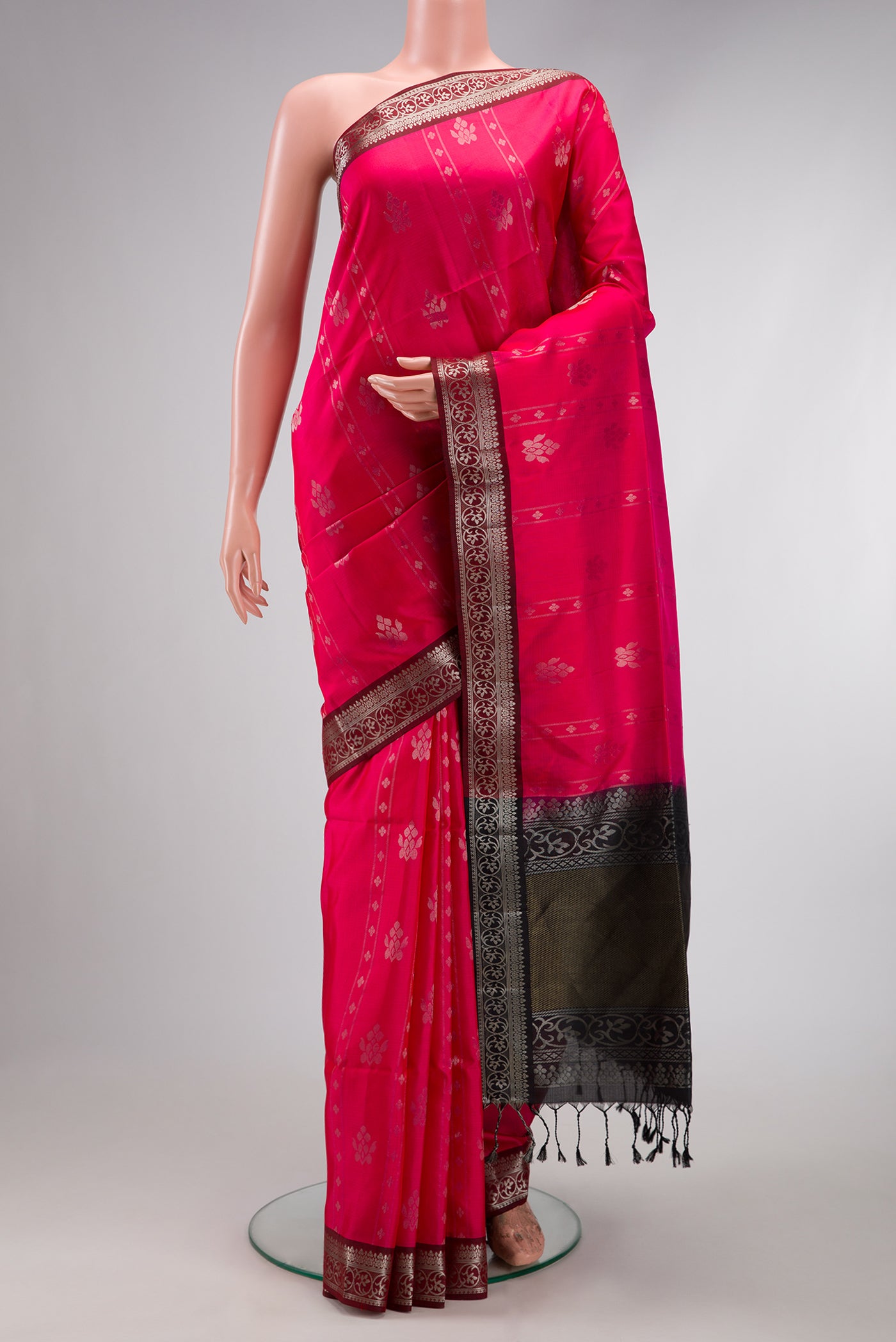 Pink Soft Silk Saree with Zari Butta on the body and Zari Border.  displayed on a mannequin