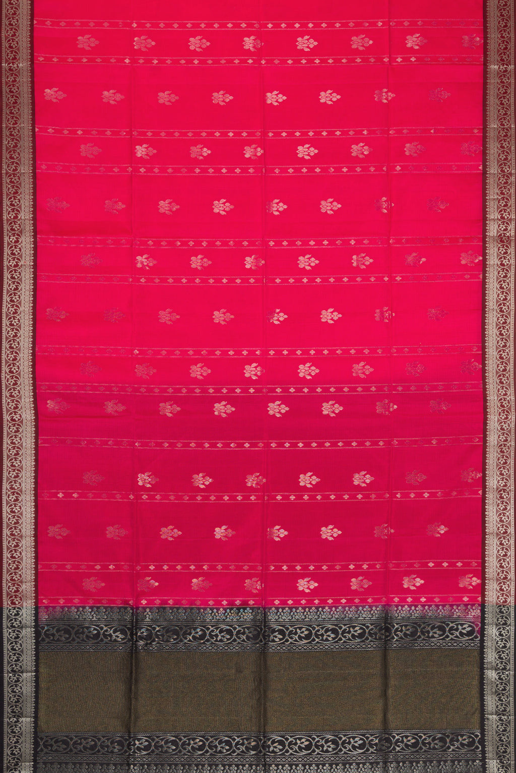 Flat view of Pink Soft Silk Saree with Zari Butta on the body and Zari Border. 
