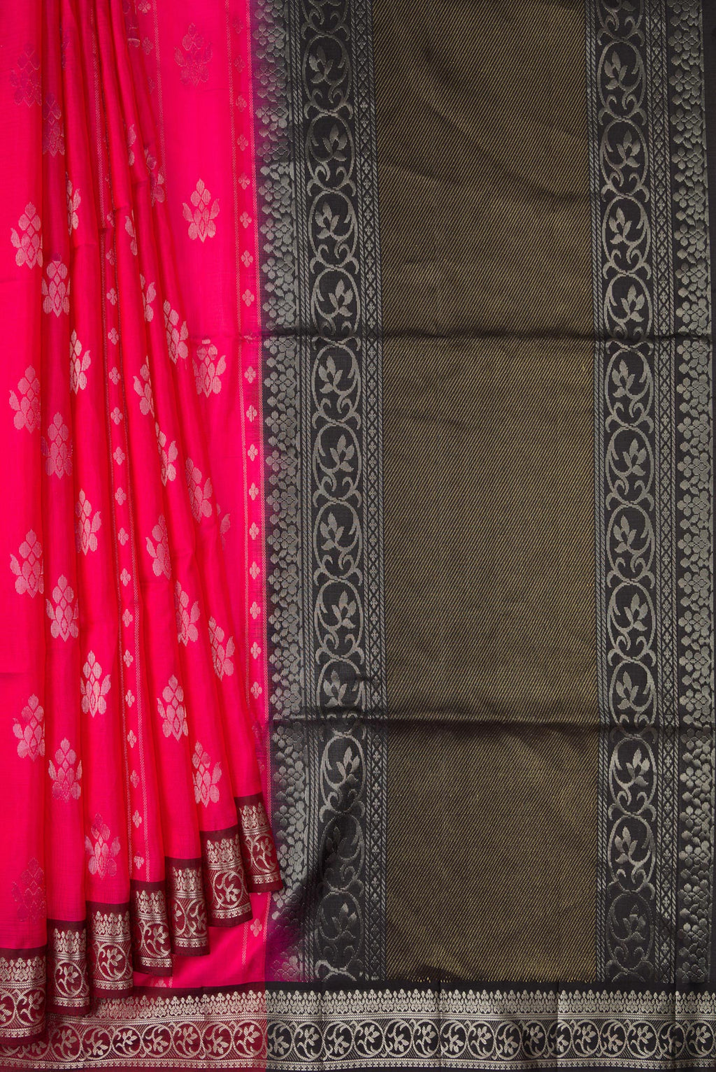 Pleats and pallu of Pink Soft Silk Saree with Zari Butta on the body and Zari Border. 