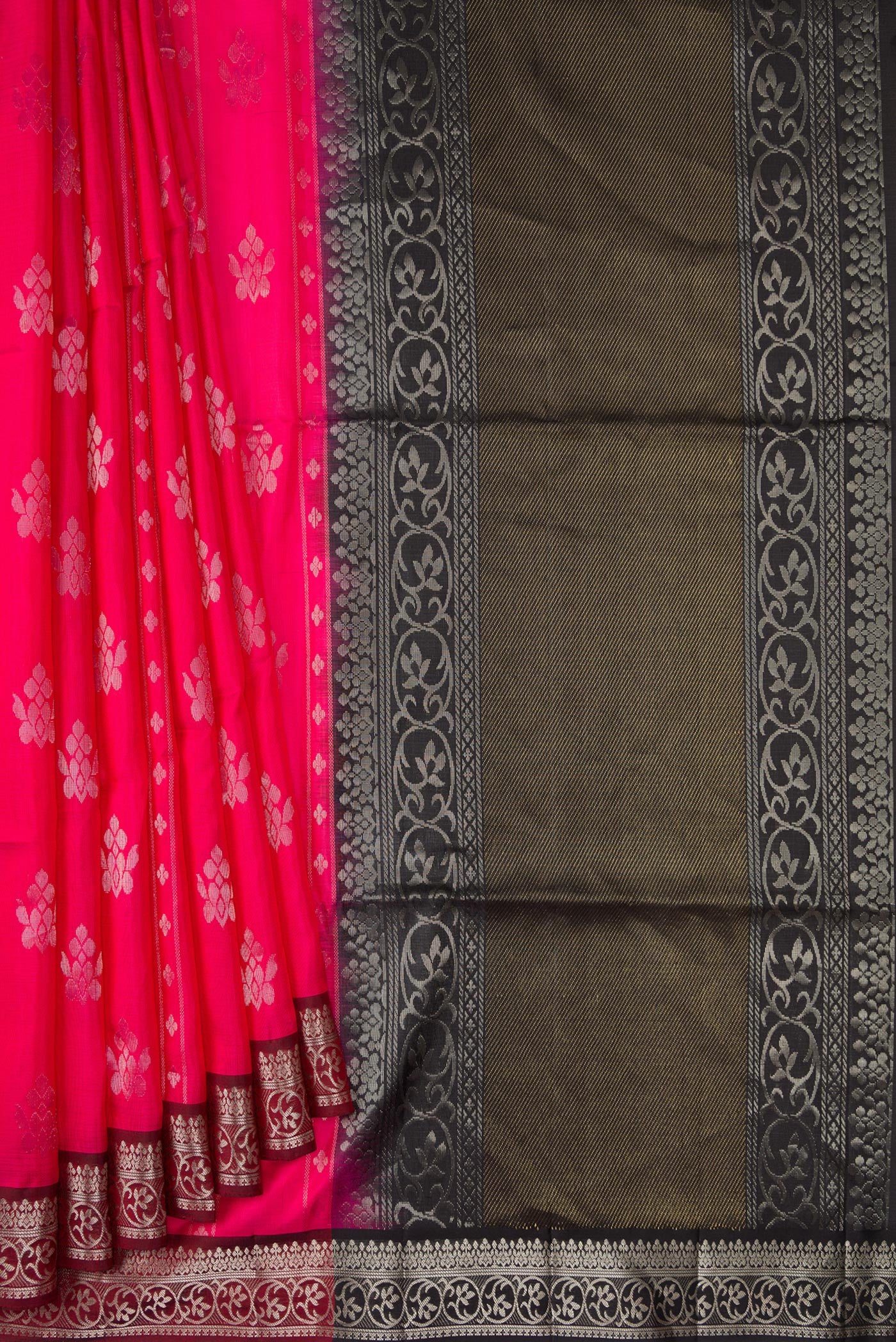 Pleats and pallu of Pink Soft Silk Saree with Zari Butta on the body and Zari Border. 
