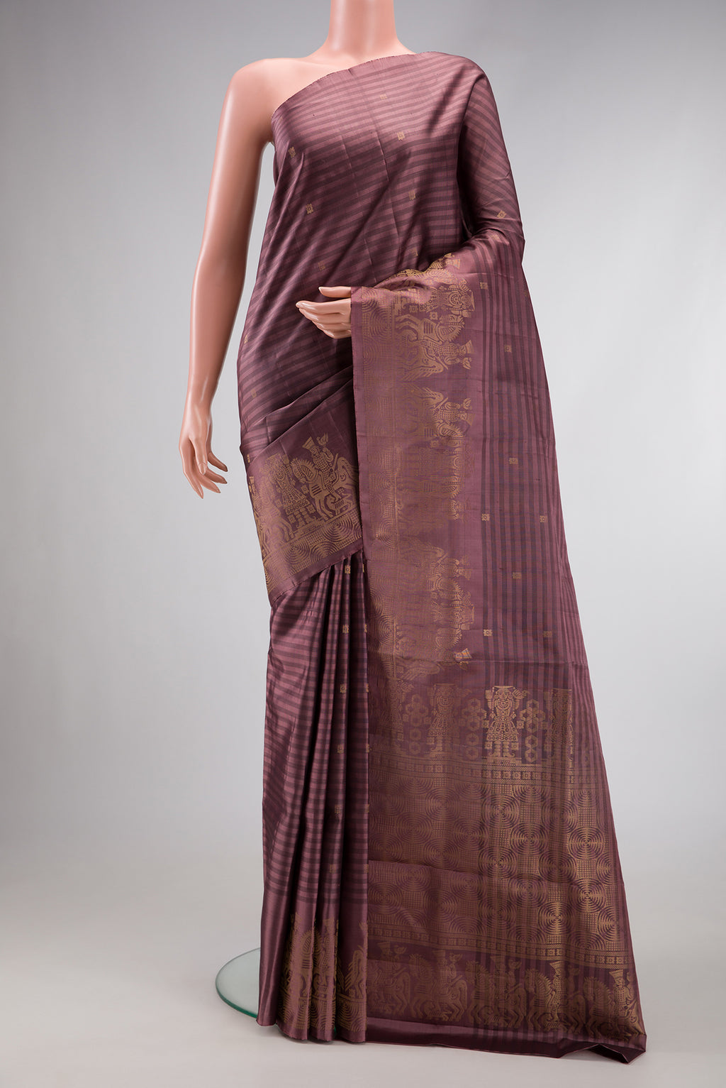 Brown Dual Tone Soft Silk Saree with Stripes on the body and Fancy Border.  displayed on a mannequin