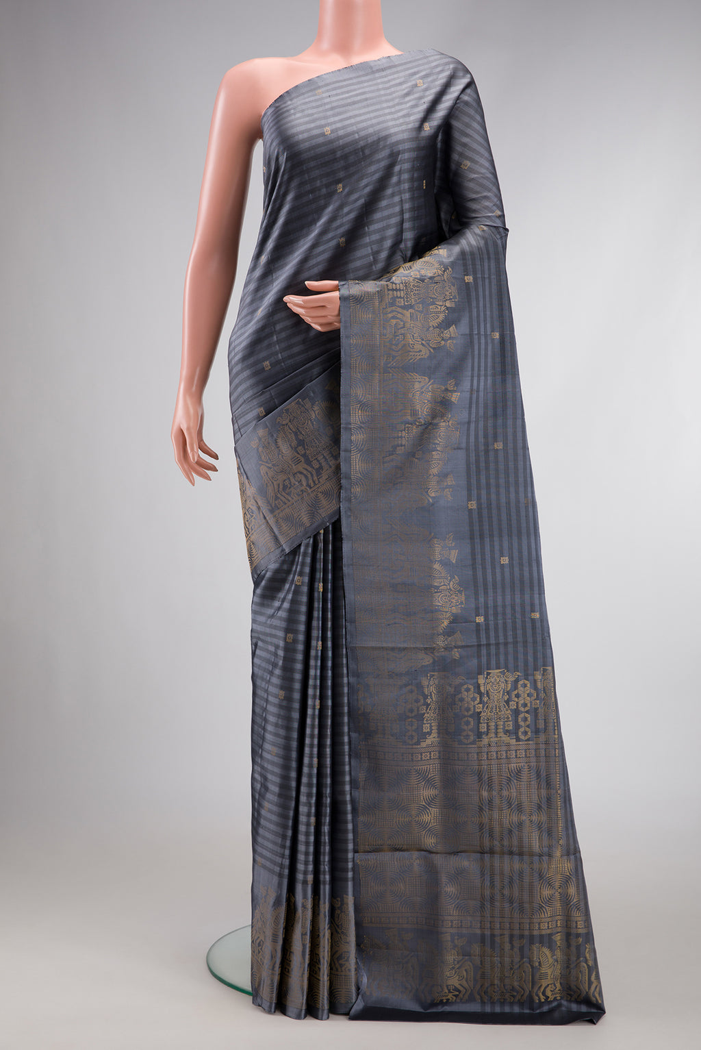 Grey Dual Tone Soft Silk Saree with Stripes on the body and Fancy Border.  displayed on a mannequin