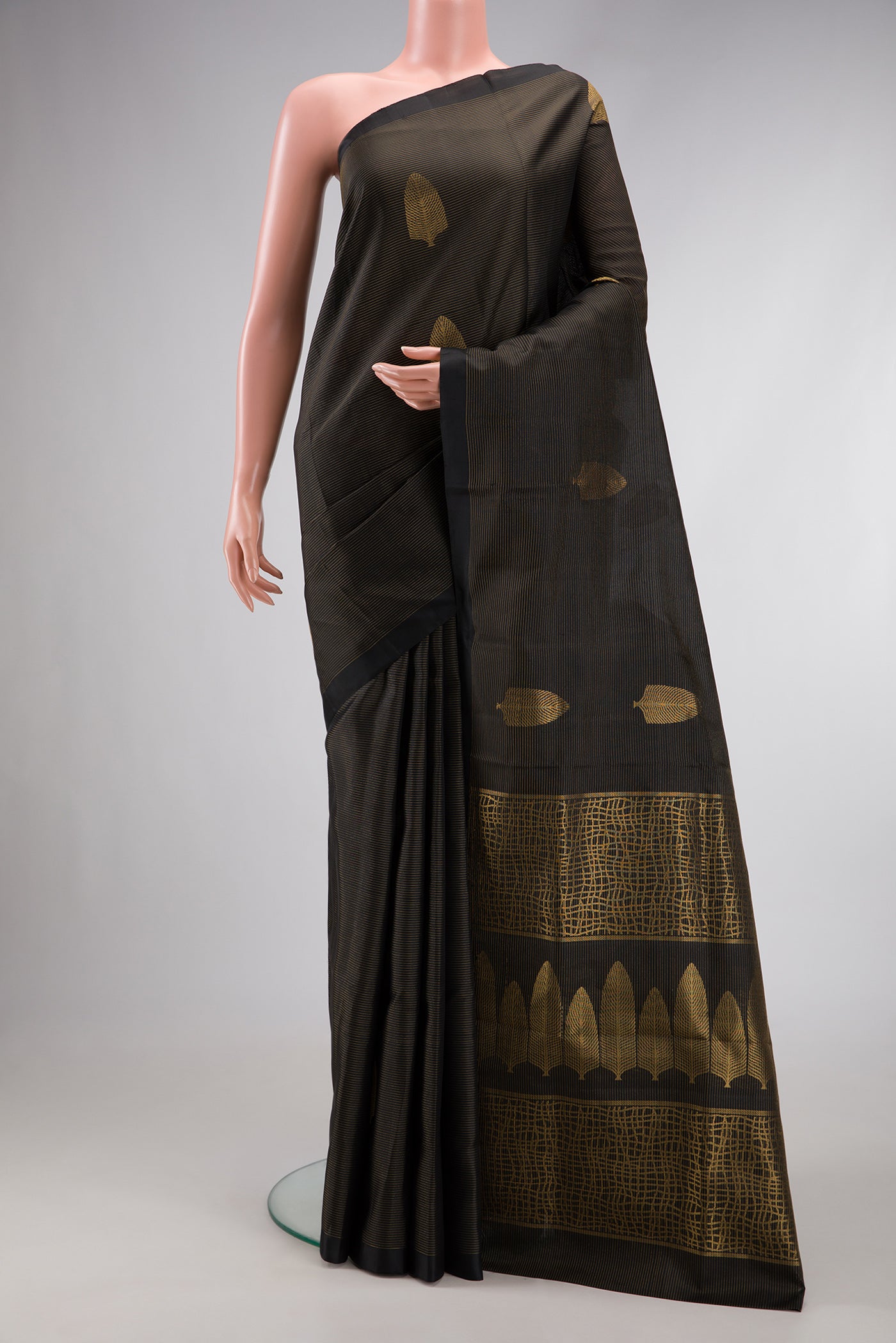 Black Dual Tone Soft Silk Saree with Stripes on the body and Plain Border.  displayed on a mannequin