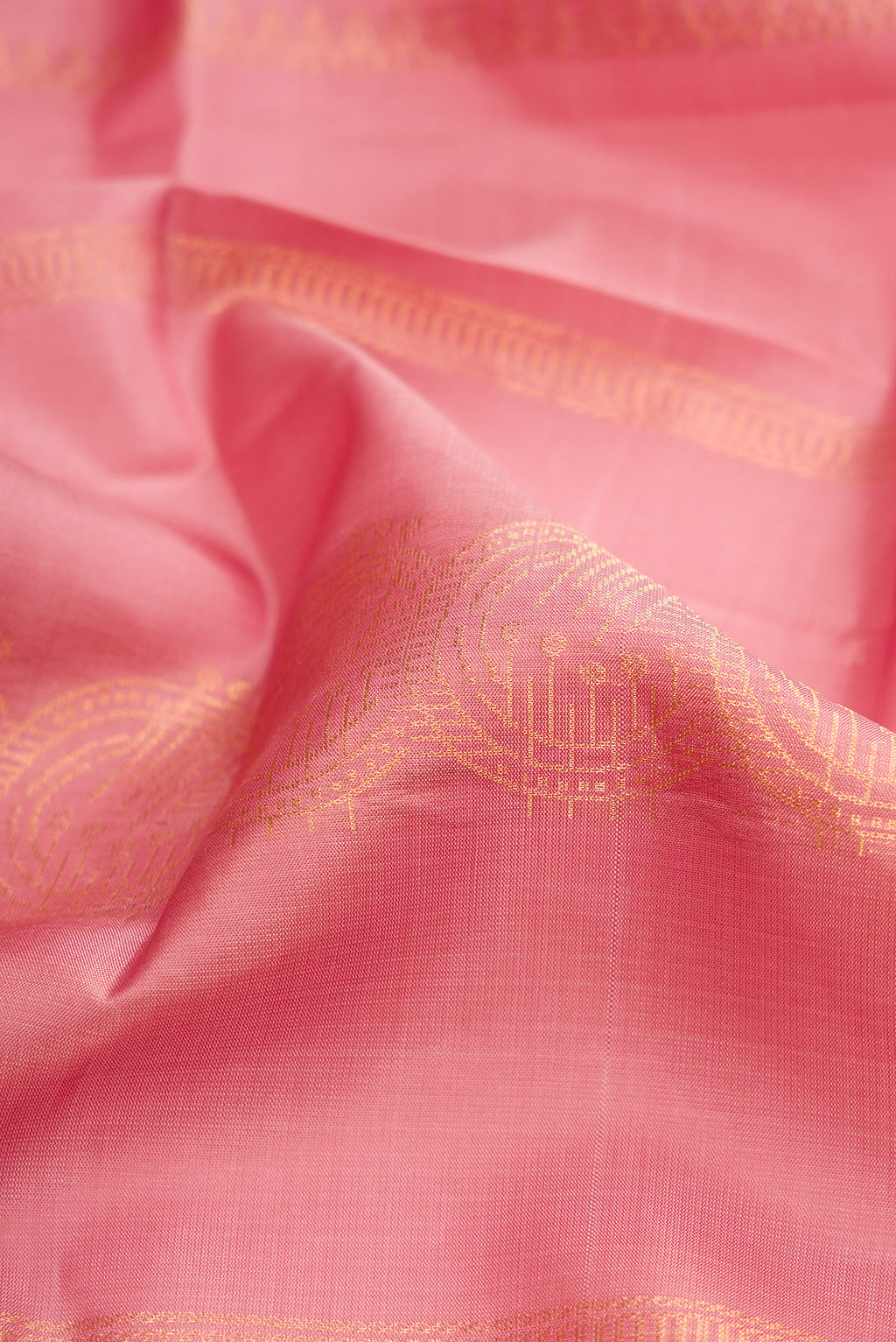 Close up of Rose Gold Dual Tone Soft Silk Saree with Stripes on the body and Without Border.  displaying folds