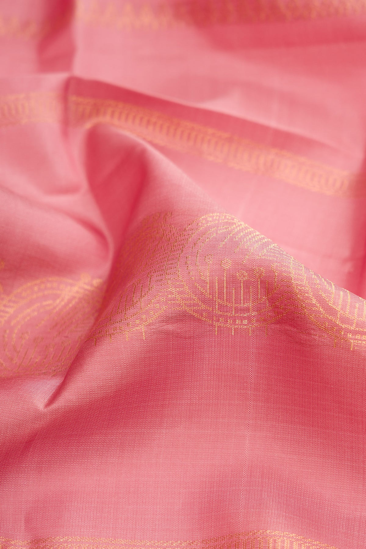 Close up of Rose Gold Dual Tone Soft Silk Saree with Stripes on the body and Without Border.  displaying folds