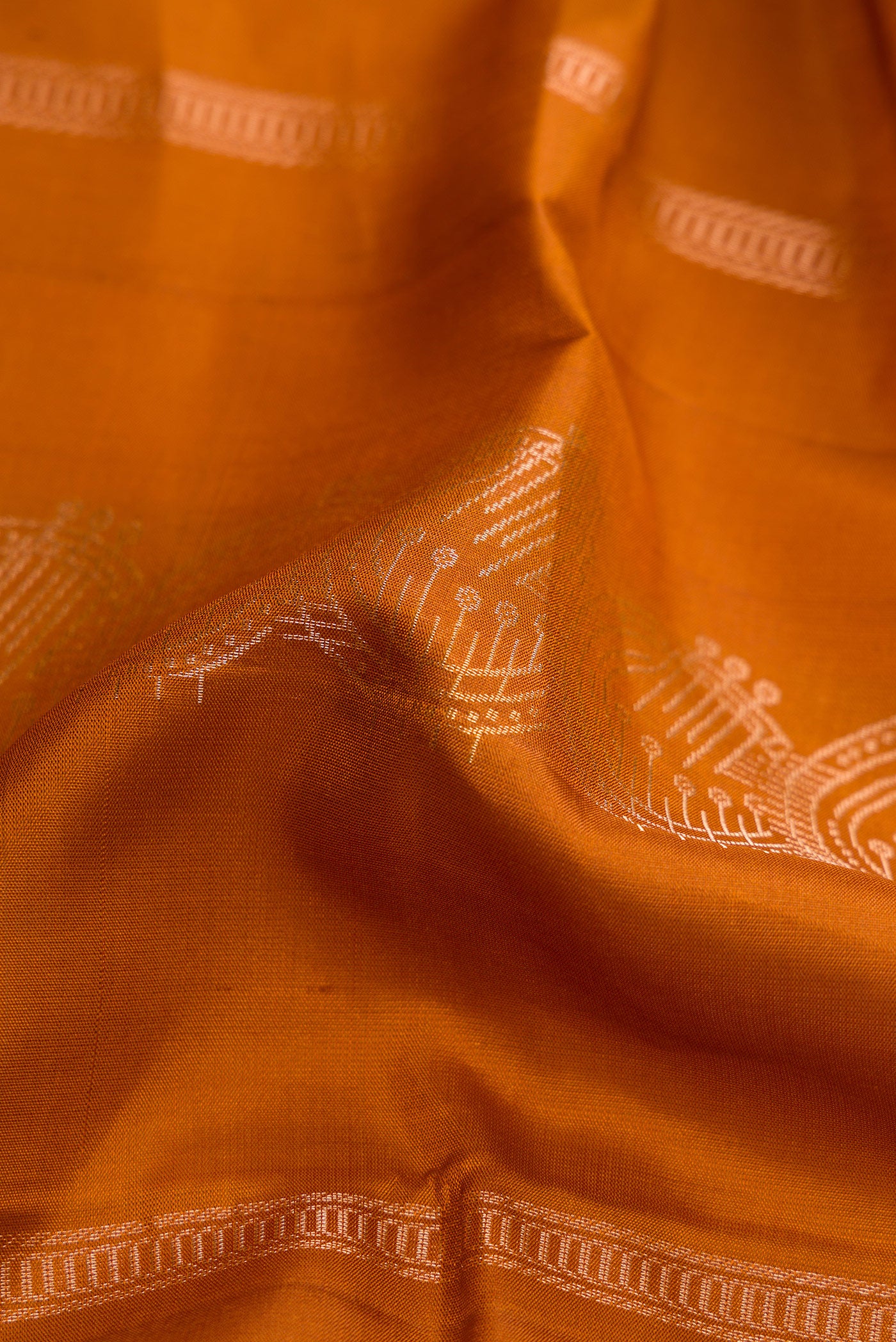 Close up of Mustard Dual Tone Soft Silk Saree with Stripes on the body and Without Border.  displaying folds