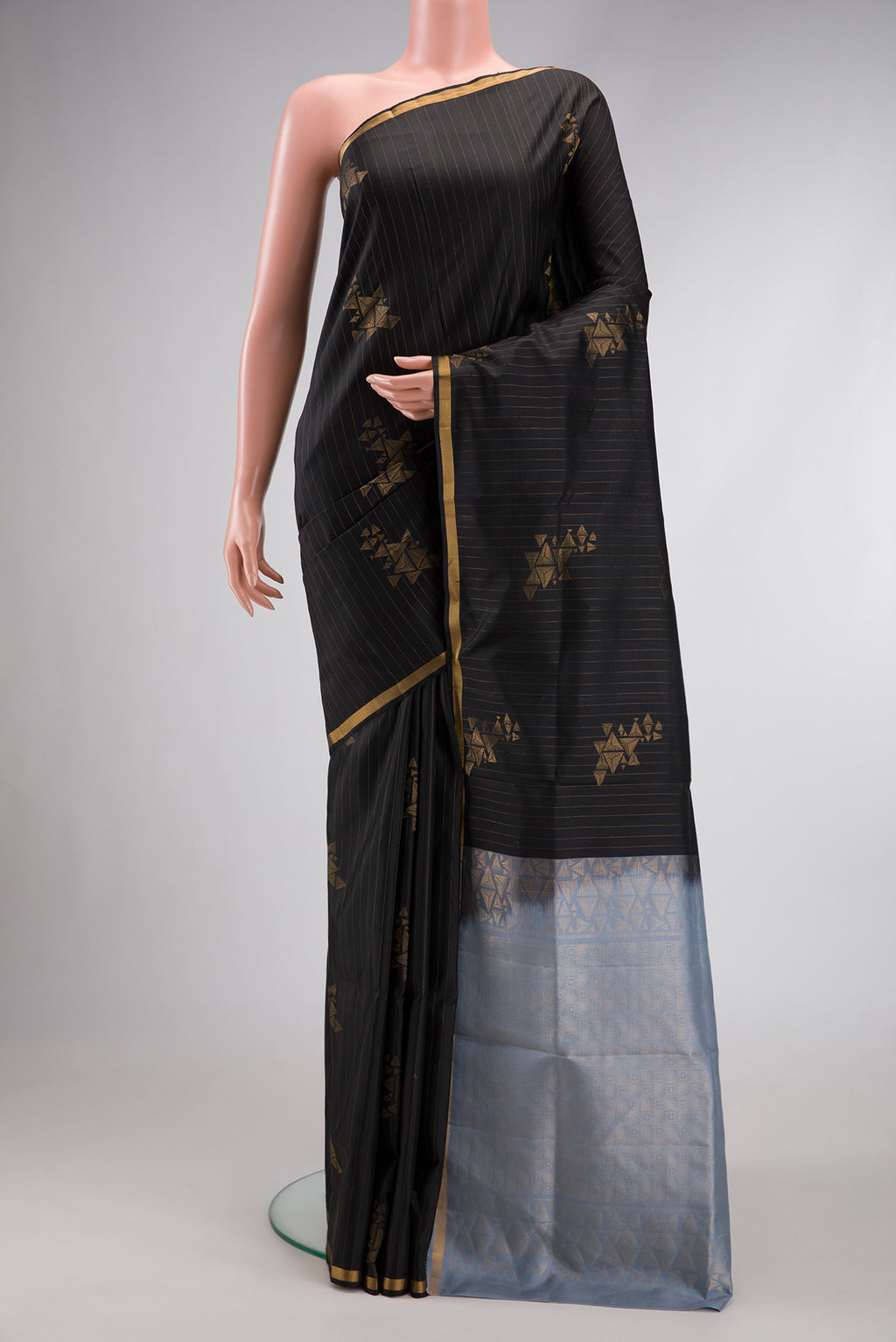 Black Dual Tone Soft Silk Saree with Stripes on the body and Zari Border.  displayed on a mannequin