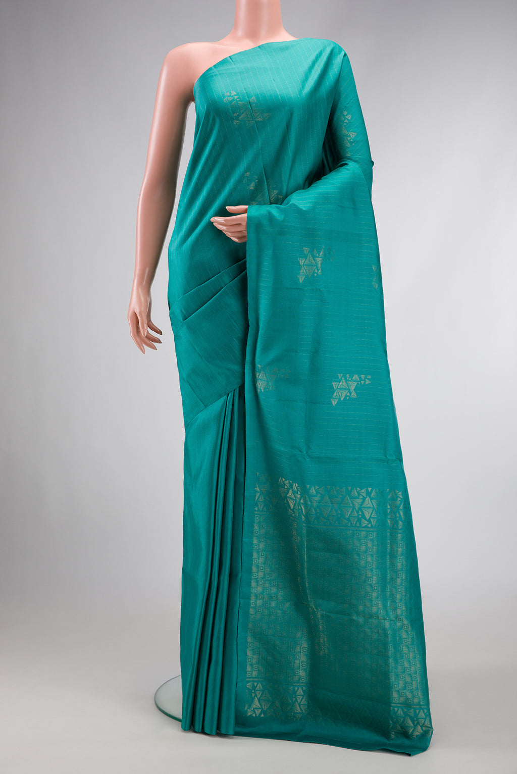 Maya Blue Dual Tone Soft Silk Saree with Zari Butta on the body and Without Border.  displayed on a mannequin