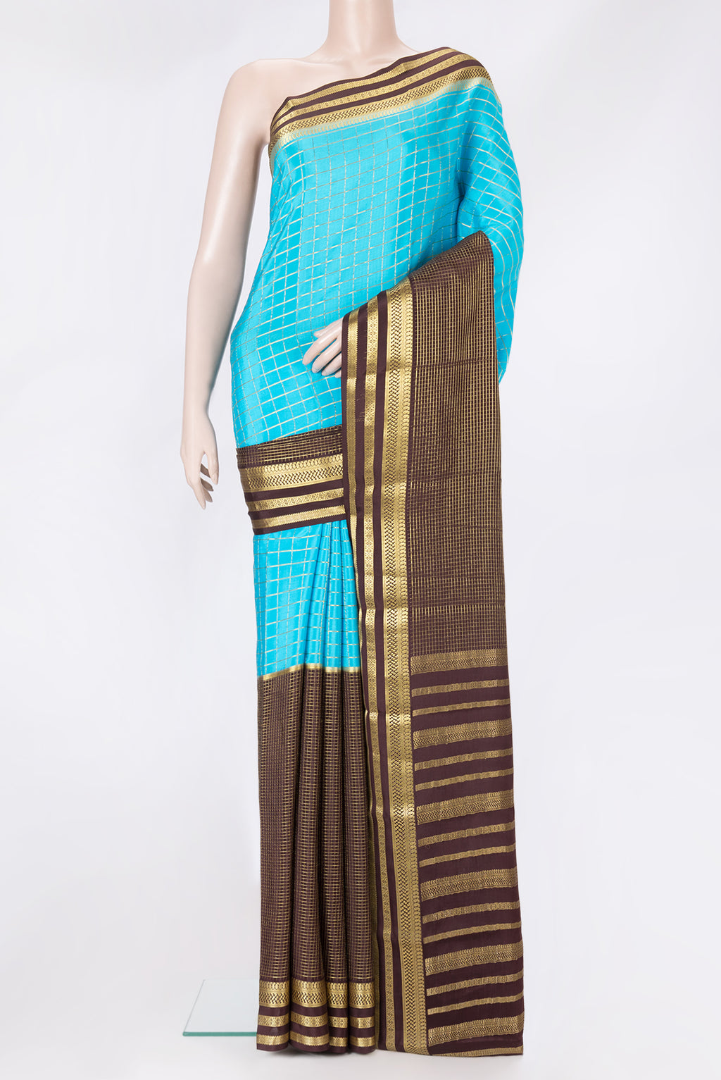 Sky Blue and Coffee Brown Color Mysore Silk Saree with Half And Half on the body and Zari Border.  displayed on a mannequin
