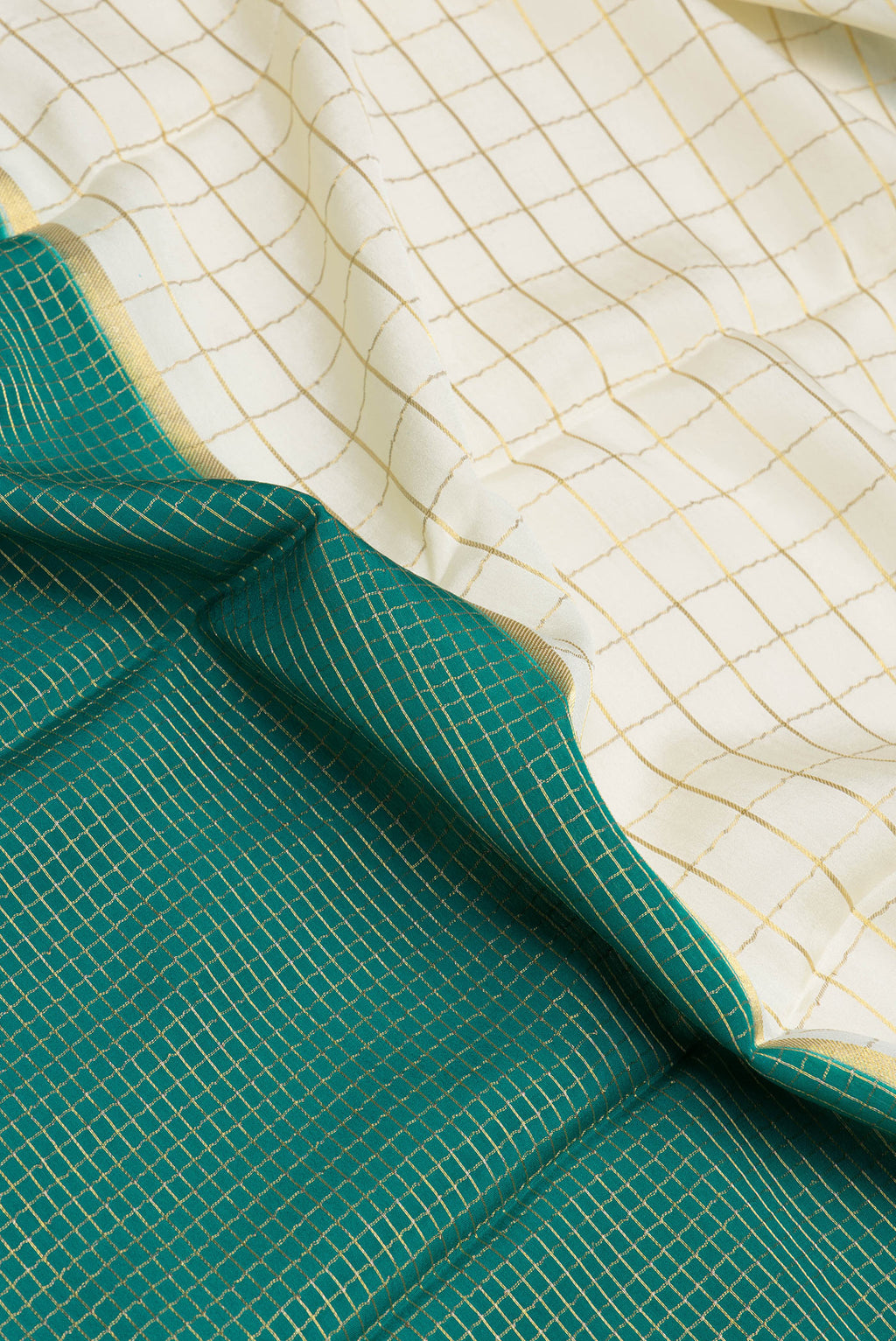 Close up of Multi Color Mysore Silk Saree with Half And Half on the body and Zari Border.  displaying folds