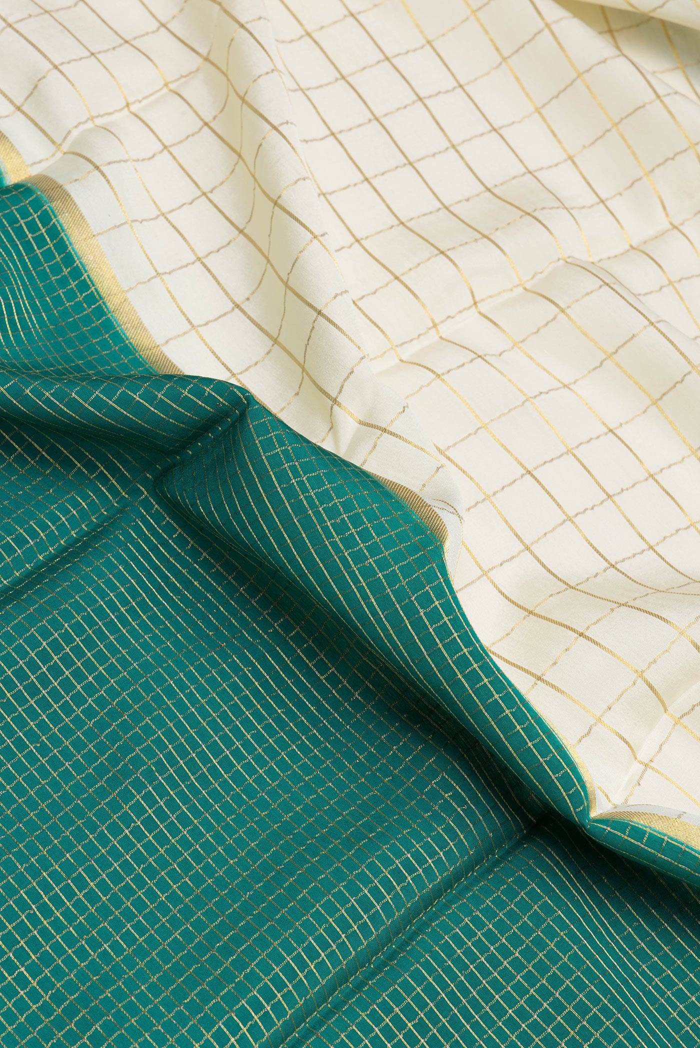 Close up of Multi Color Mysore Silk Saree with Half And Half on the body and Zari Border.  displaying folds