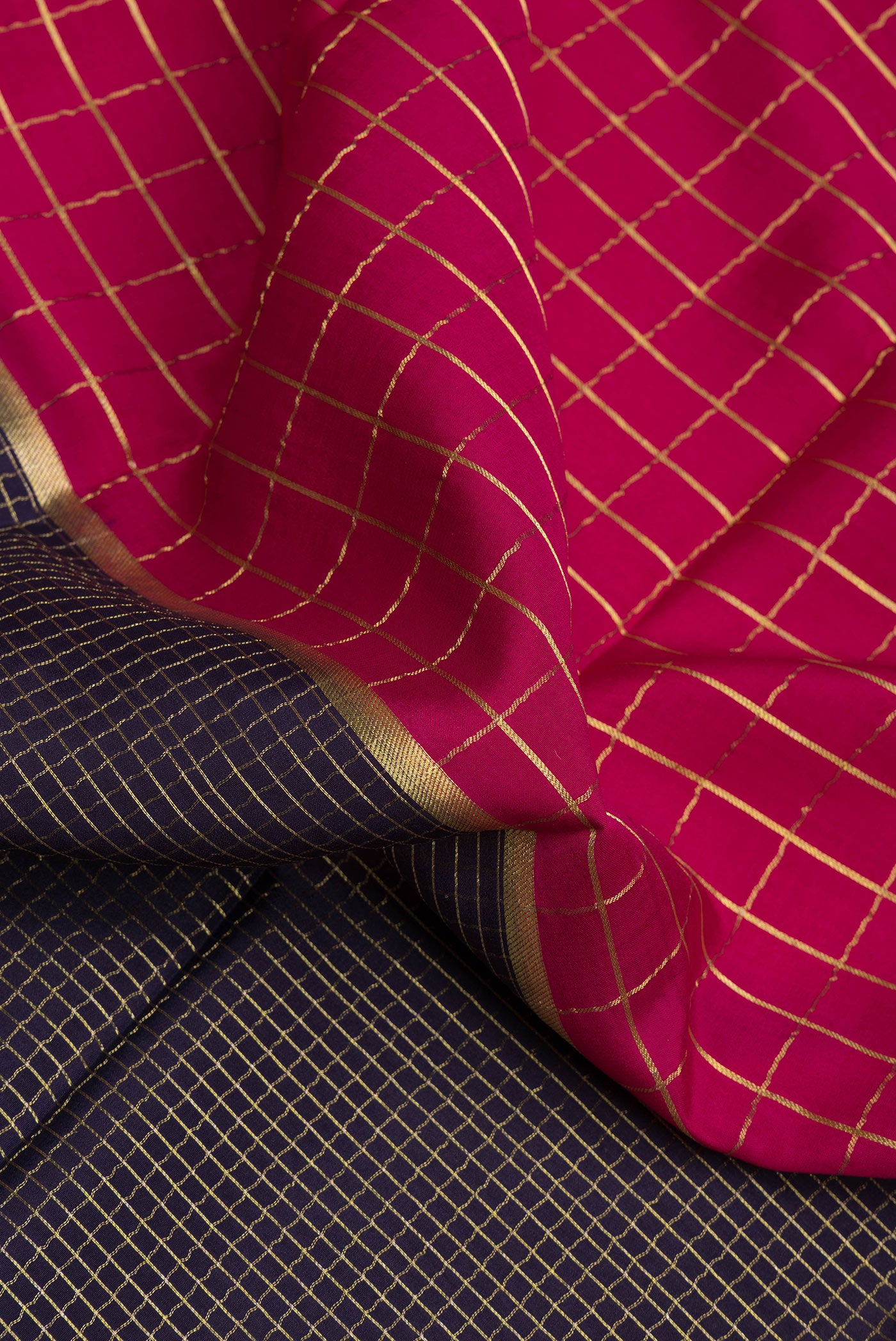 Close up of Multi Color Mysore Silk Saree with Checked design on the body and Zari Border.  displaying folds