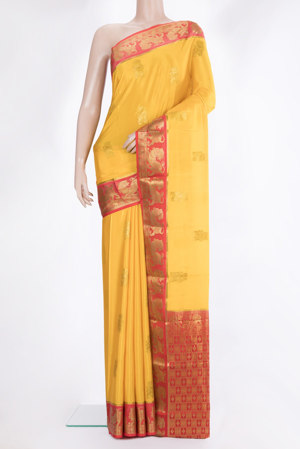 Yellow Mysore Crepe Saree with Zari Butta on the body and Fancy Border.  displayed on a mannequin