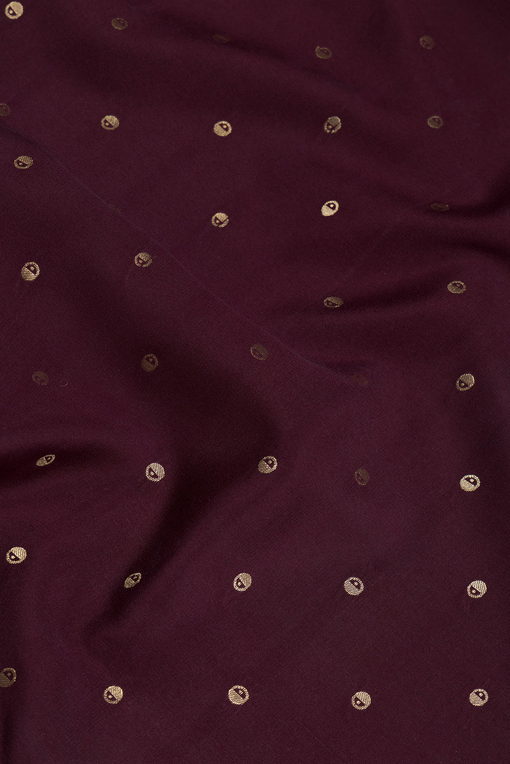 Close up of Coffee Brown Mysore Silk Saree with Zari Butta on the body and Zari Border.  displaying folds