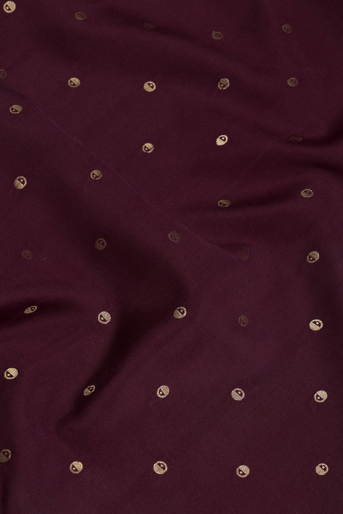 Close up of Coffee Brown Mysore Silk Saree with Zari Butta on the body and Zari Border.  displaying folds