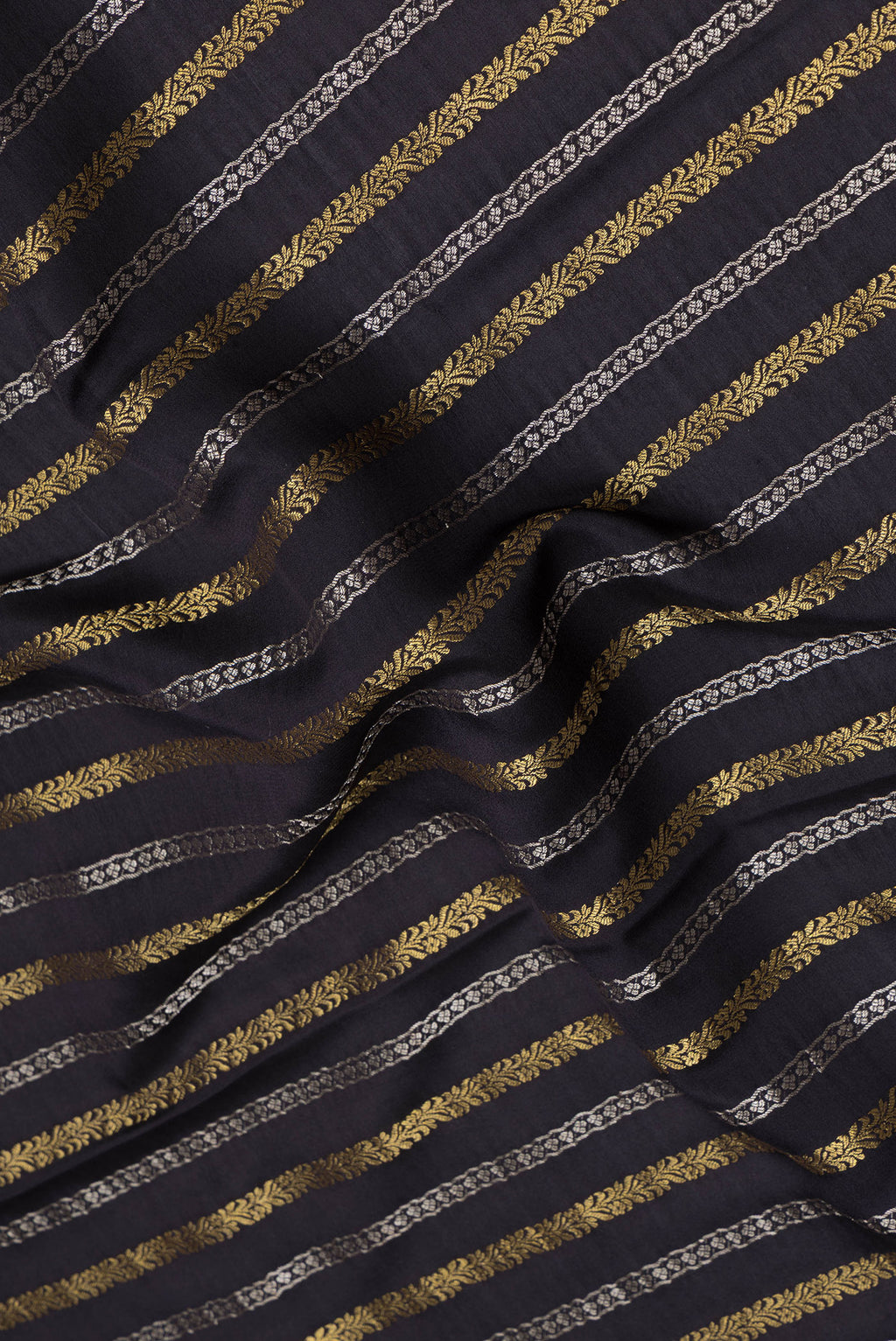 Close up of Black Mysore Silk Saree with Stripes on the body and Zari Border.  displaying folds