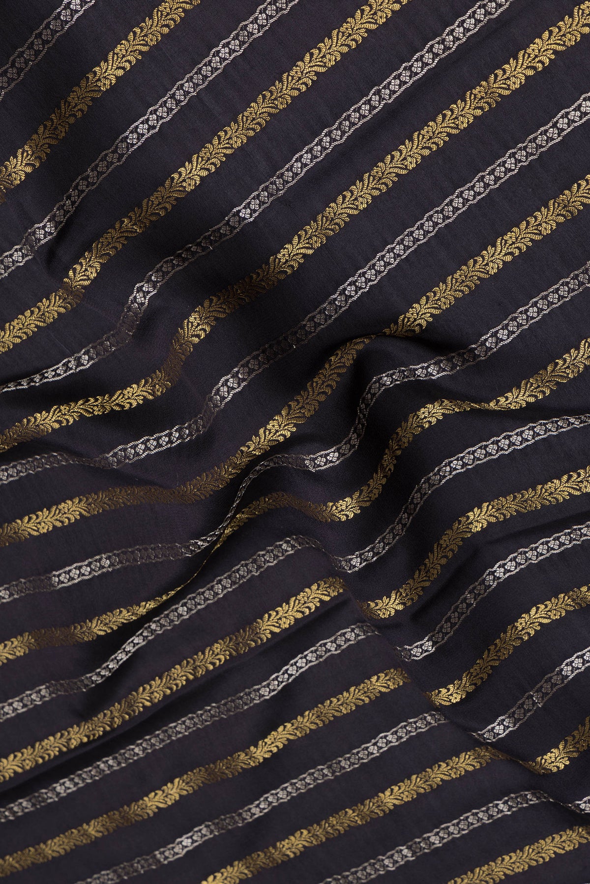 Close up of Black Mysore Silk Saree with Stripes on the body and Zari Border.  displaying folds