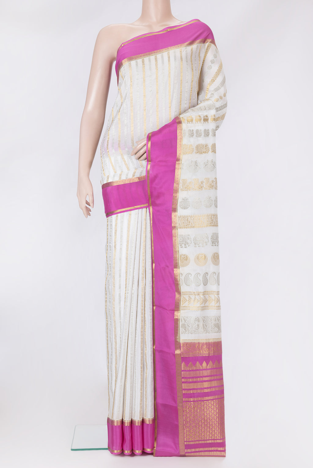 Off White Dual Tone Mysore Silk Saree with Stripes on the body and Zari Border.  displayed on a mannequin