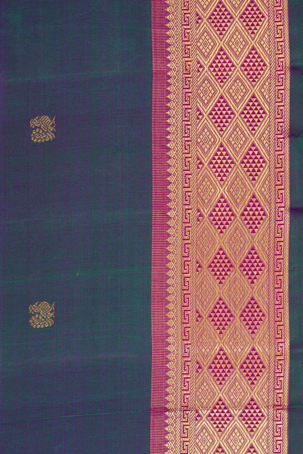 Border image of Peacock Blue Dual Tone Kanchipuram Silk Saree with Zari Butta on the body and Zari Border. 